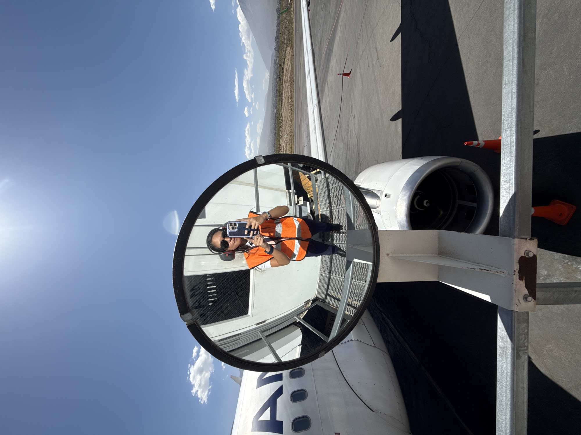 Passenger captures mirror selfie during flight over Peru mountains