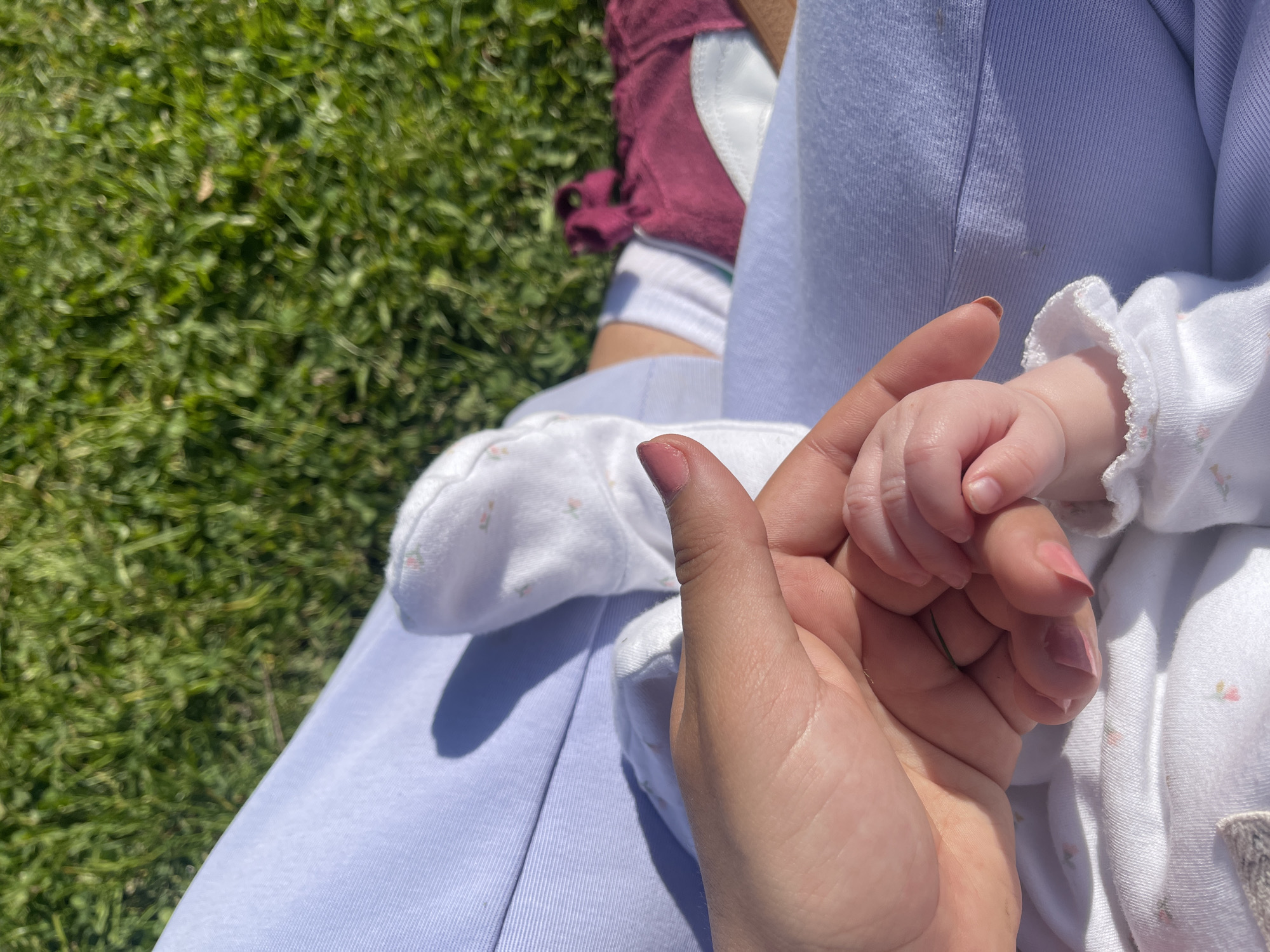 Adult and baby enjoy peaceful sunny afternoon in Maidstone