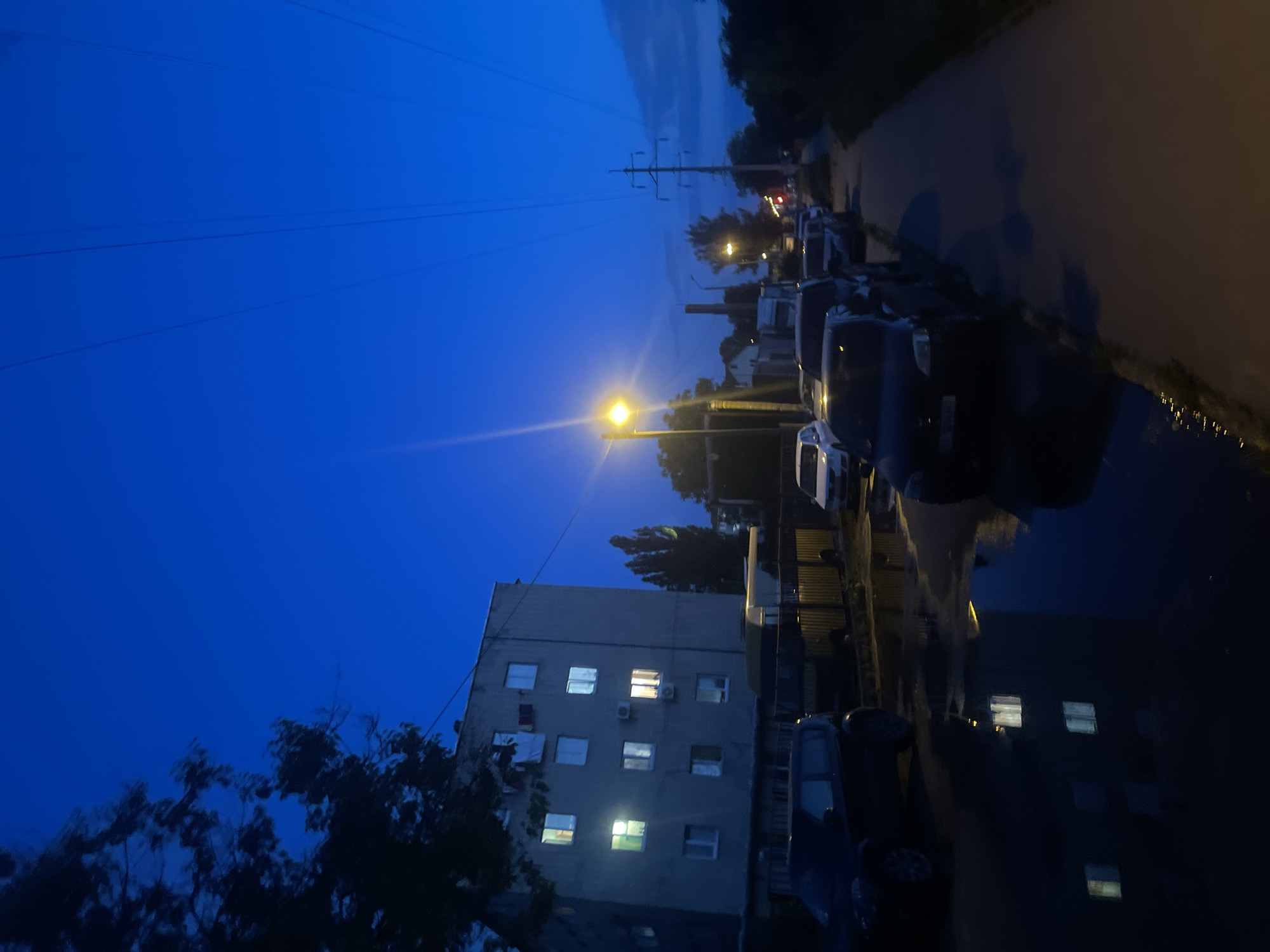 Evening scenes captured across urban area with Cyrillic signage