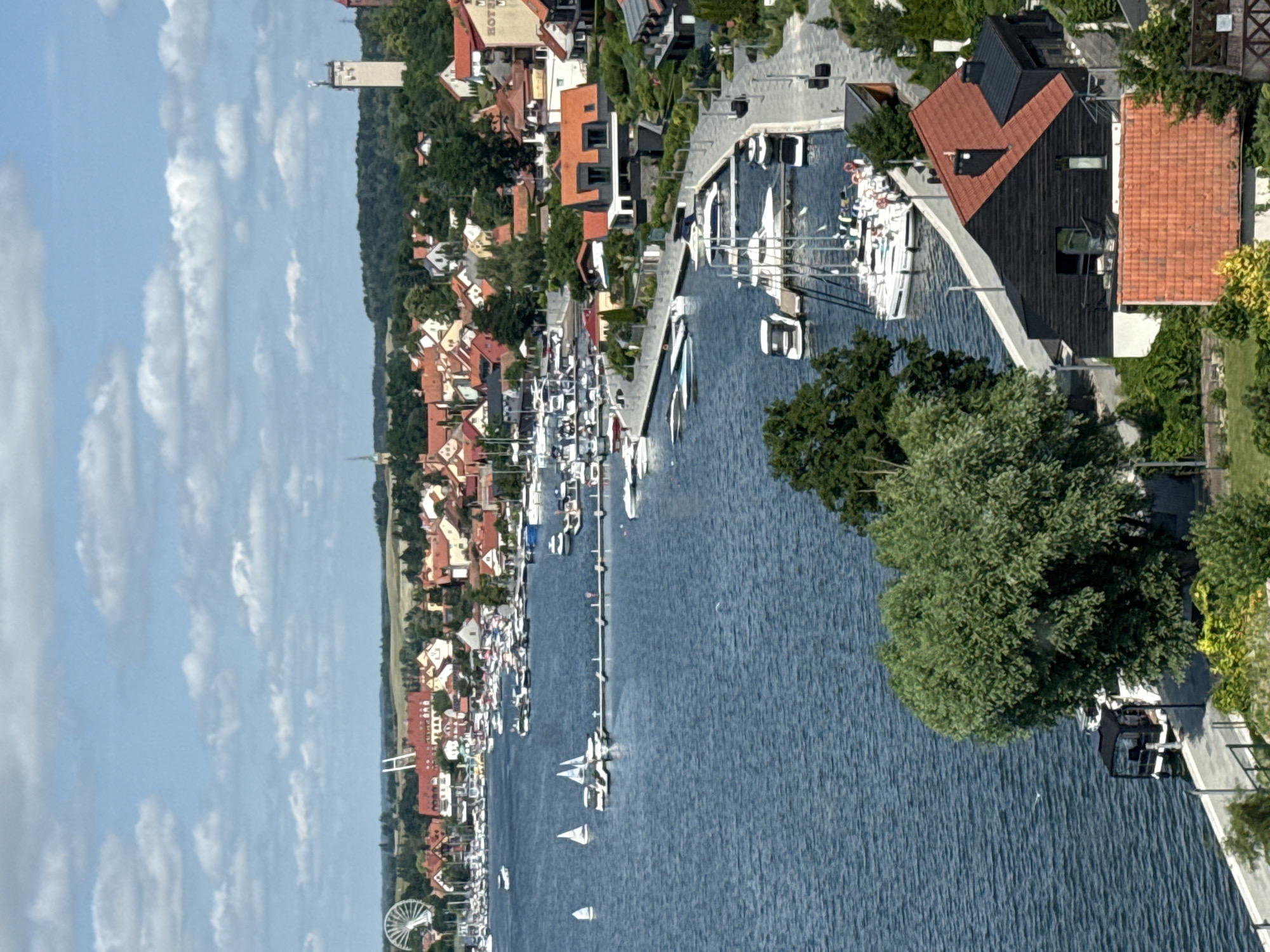 Mikołajki lakeside town: marina, forests, and active construction sites