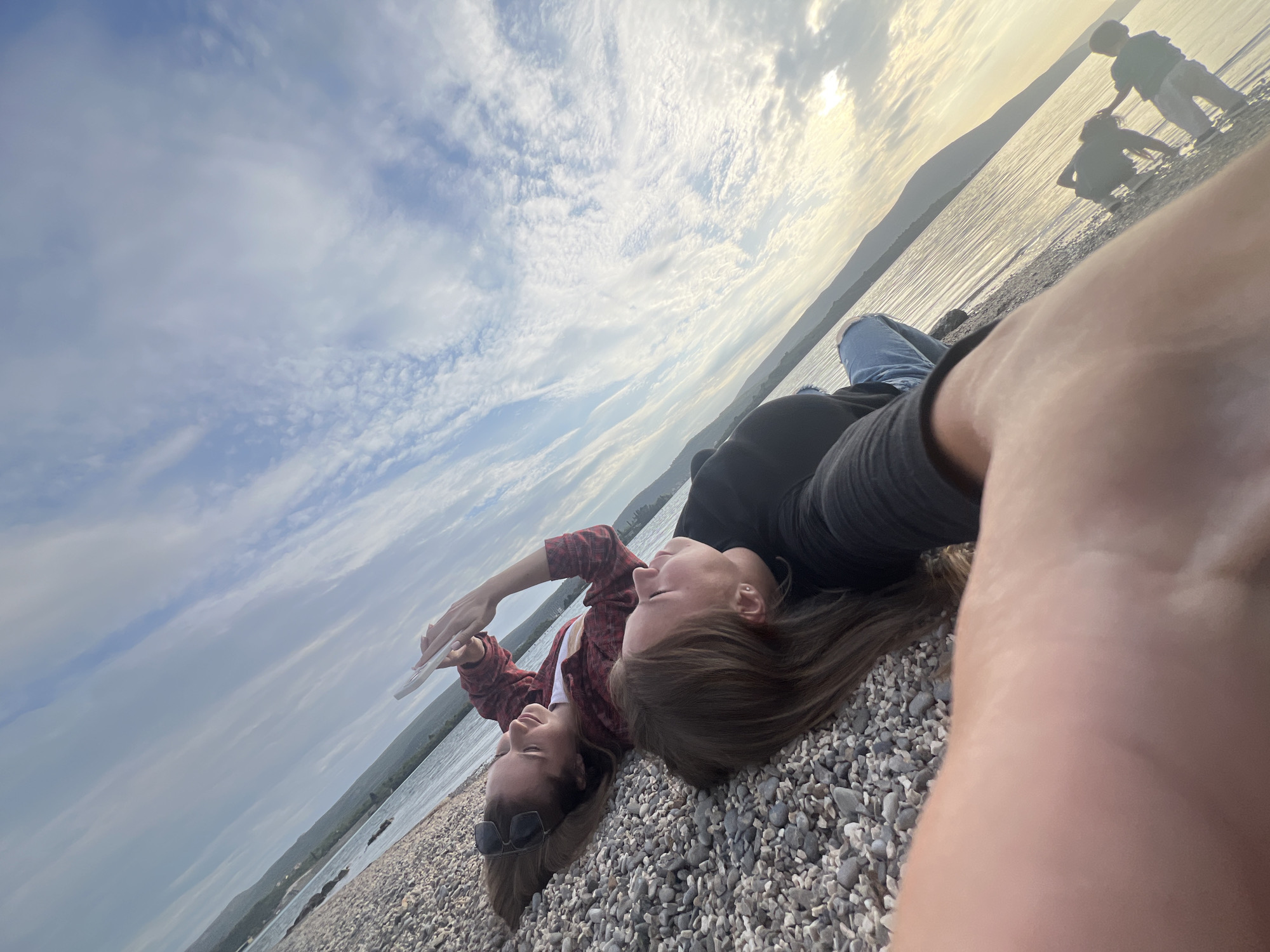 Women photograph themselves on Tivat beach