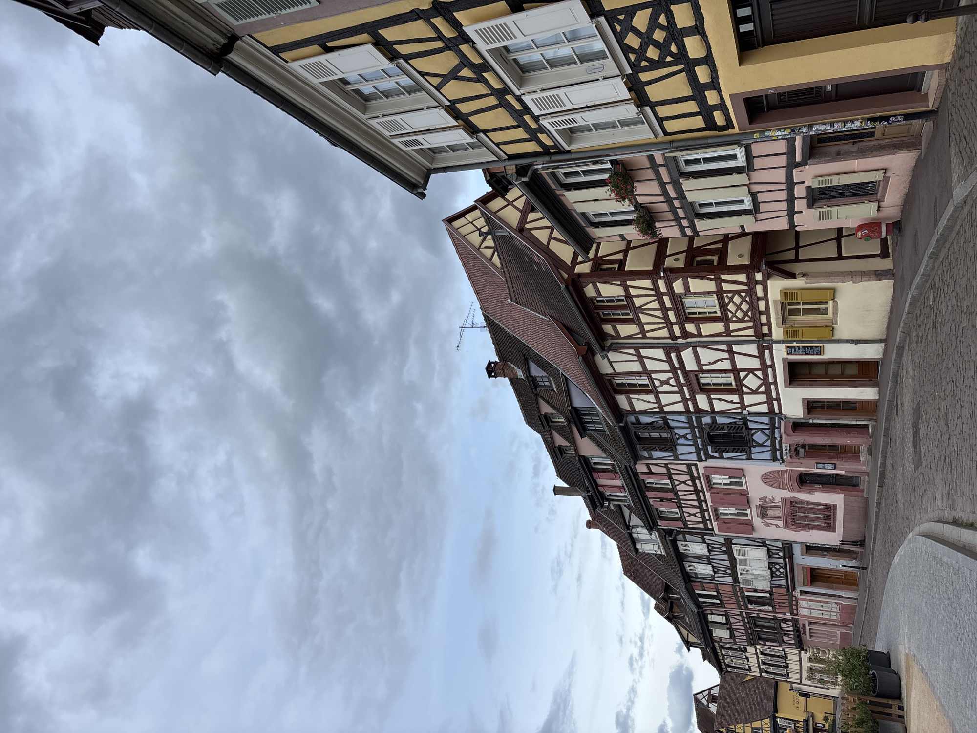 Witness documents Colmar's historic Alsatian architecture during evening walkthrough