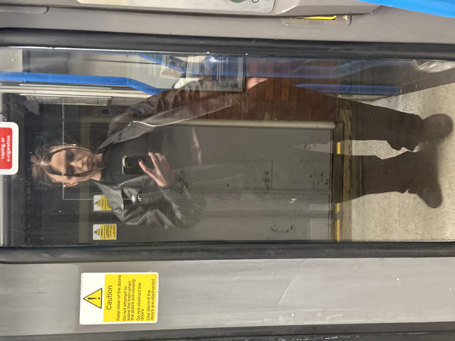 Evening commuter captures selfie amid lit windows in Tunbridge Wells