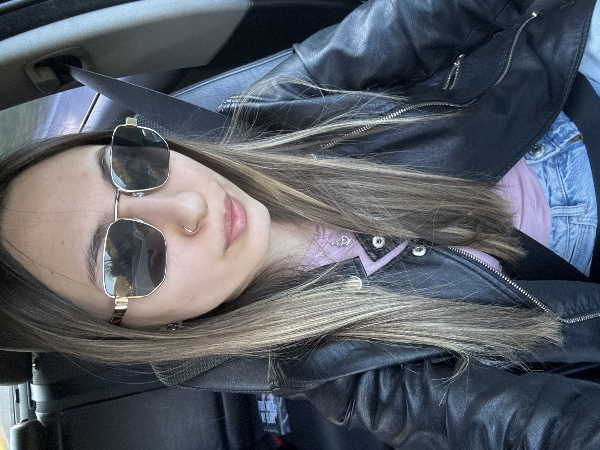 Woman takes car selfie in Bulgarian village