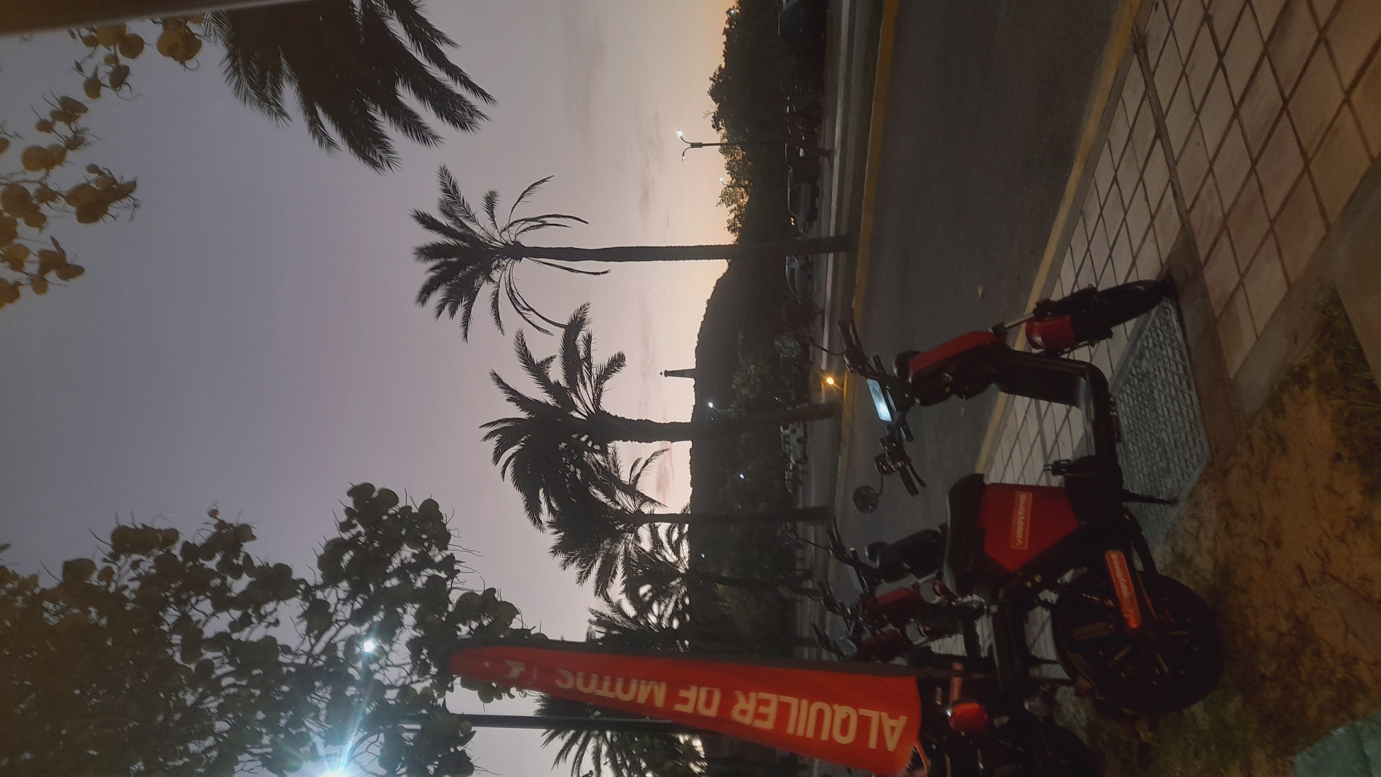 Sunset scooter rental scene in Pedro González, Venezuela