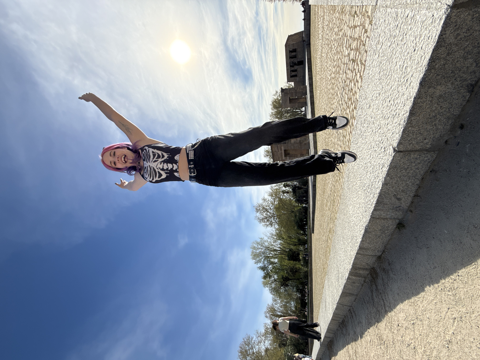 Woman poses near Temple of Debod in Madrid