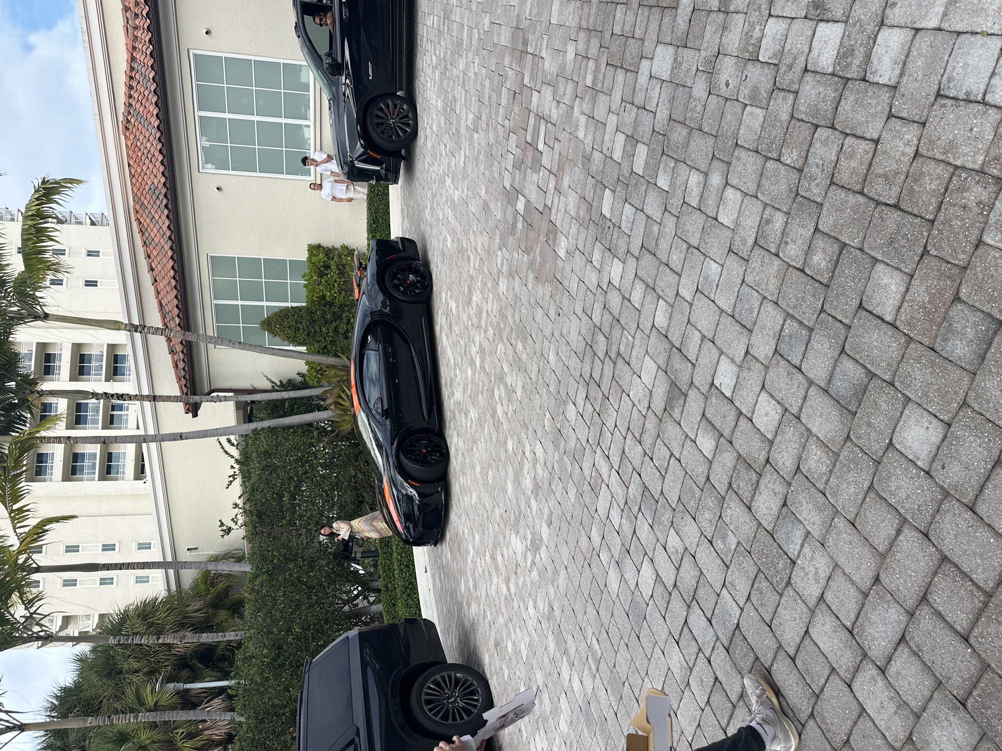 Luxury vehicles including Bugatti spotted in Aventura driveway