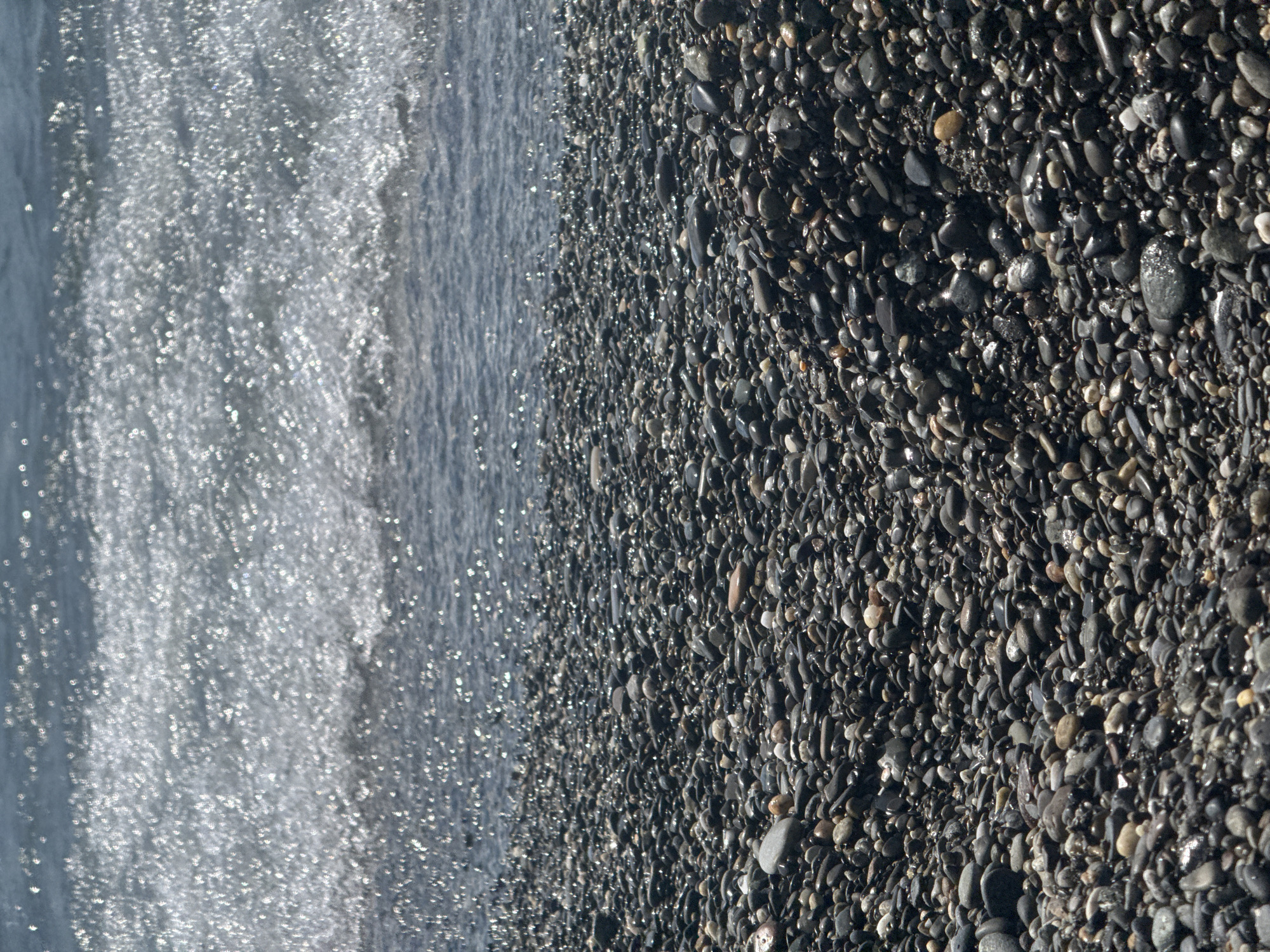 Summer afternoon on Sochi's Black Sea pebble beach