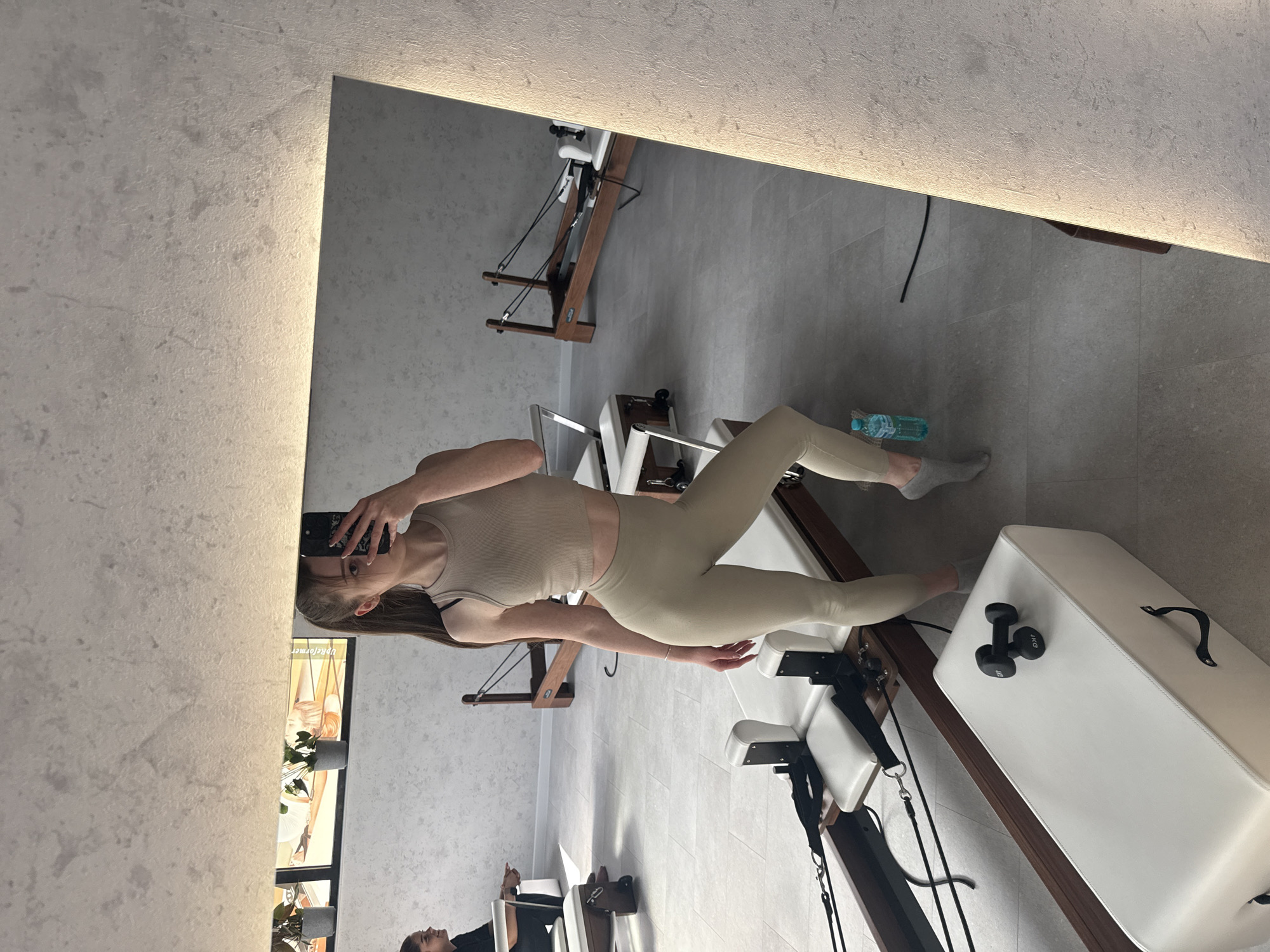 Woman Takes Mirror Selfie at Sofia Pilates Studio