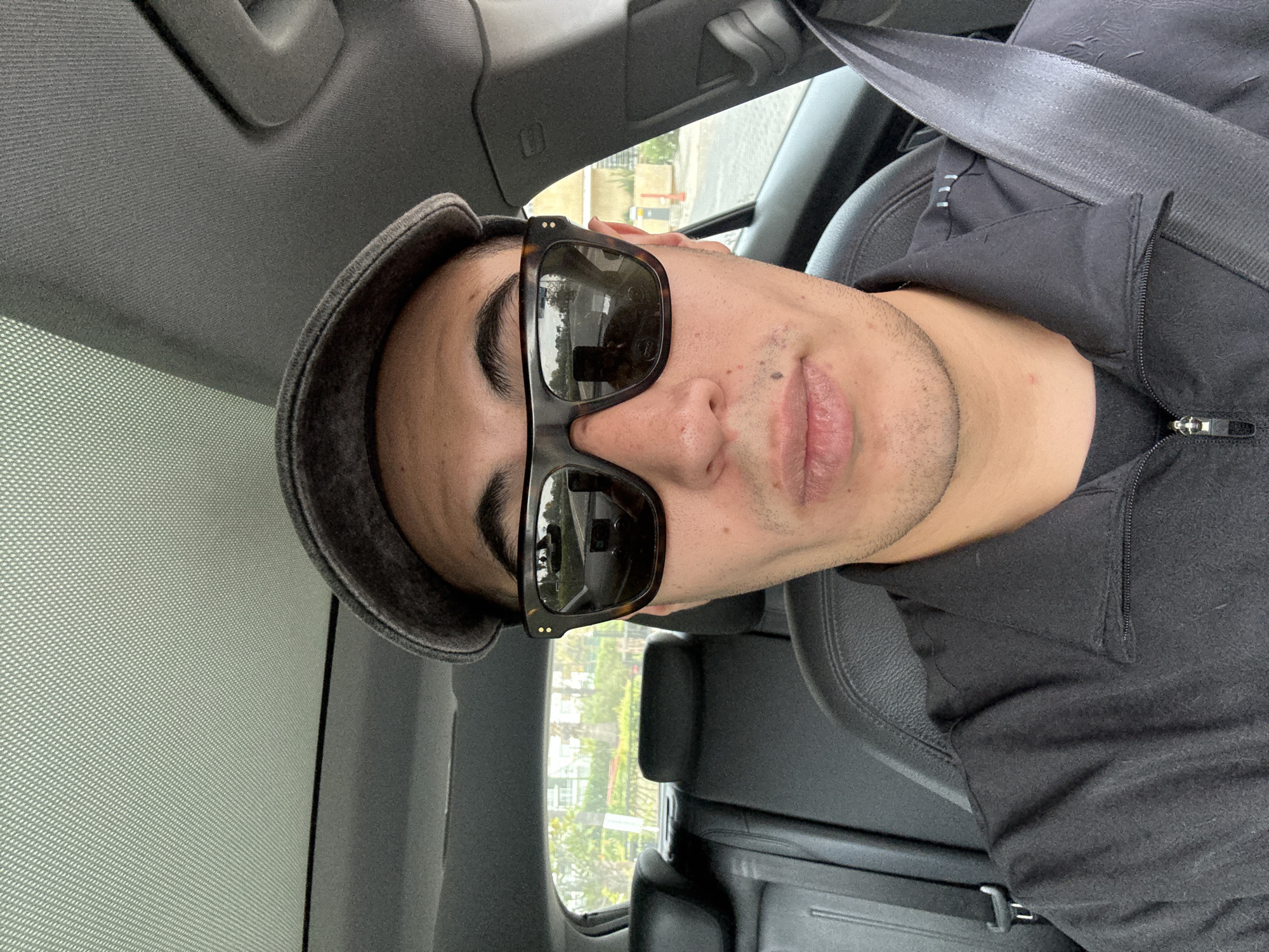 Self-portrait taken inside car in Mexican town