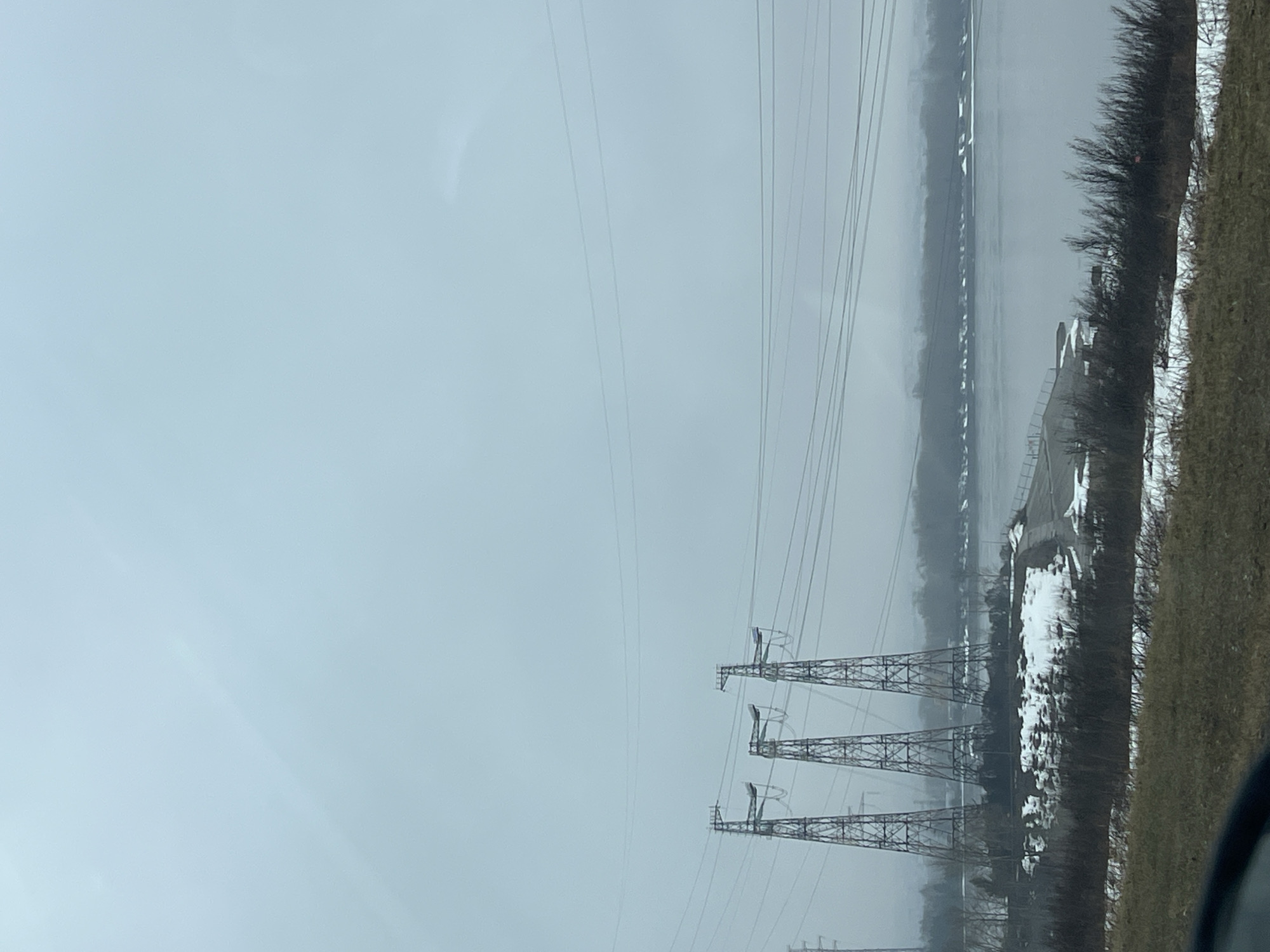 Overcast morning scene with power towers near Kama River
