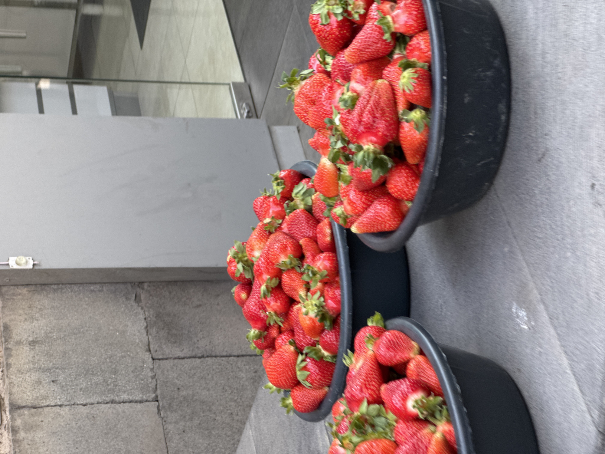 Fresh strawberries displayed in buckets on Yerevan street