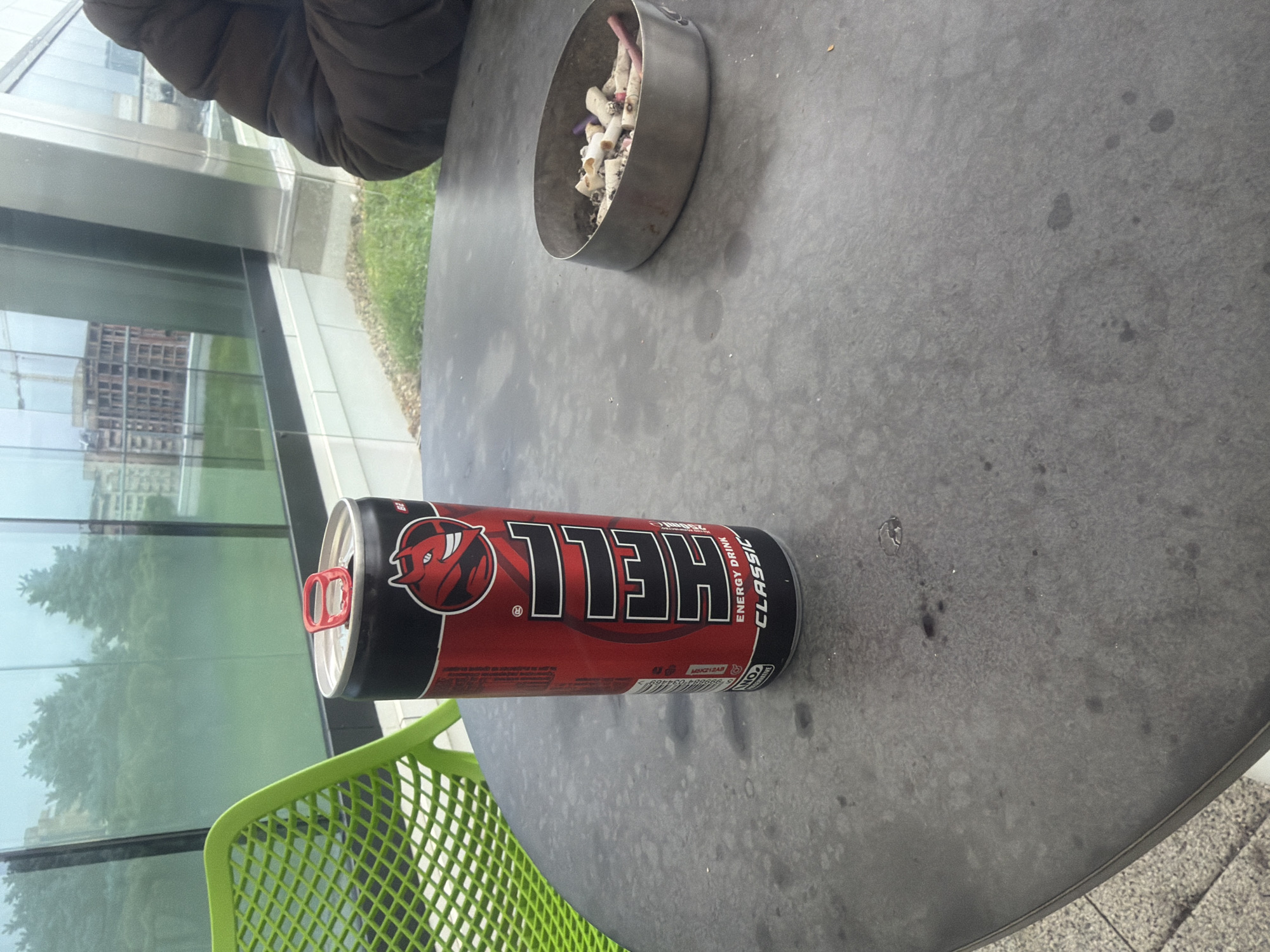 Morning café scene captured in Sofia with ashtray energy drink