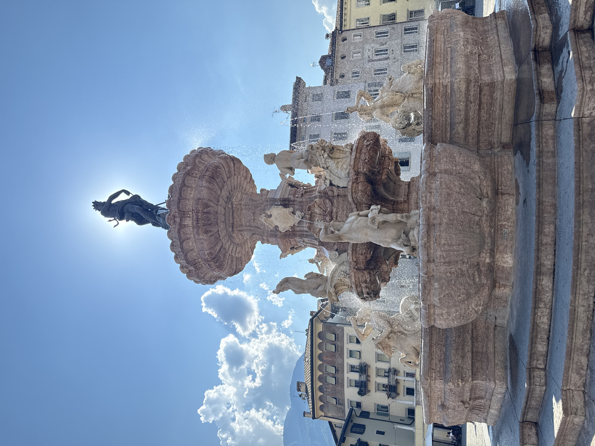 A busy afternoon around Trento's Neptune Fountain