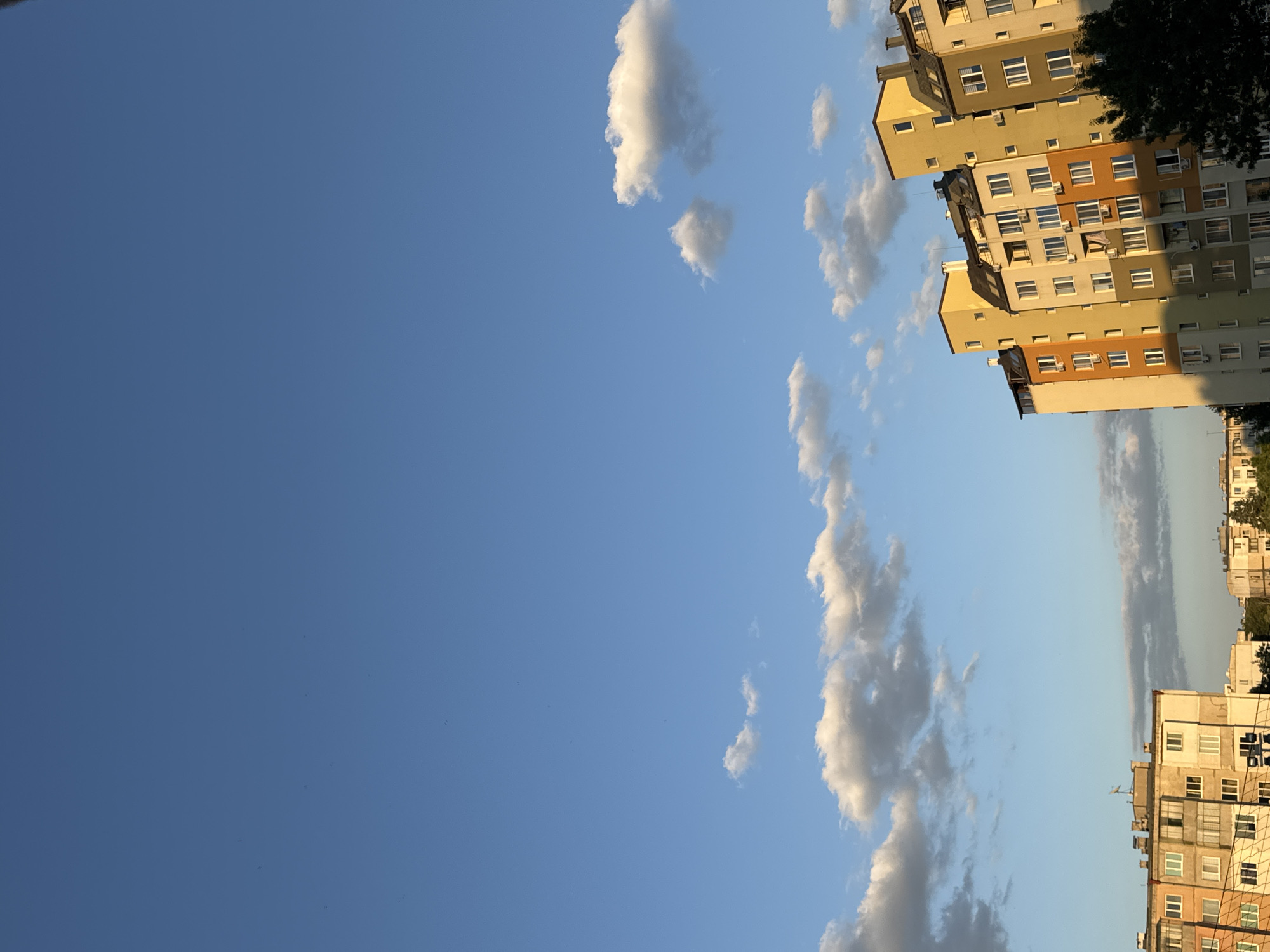 Soviet-era apartment blocks in Sofia under a clear summer sky