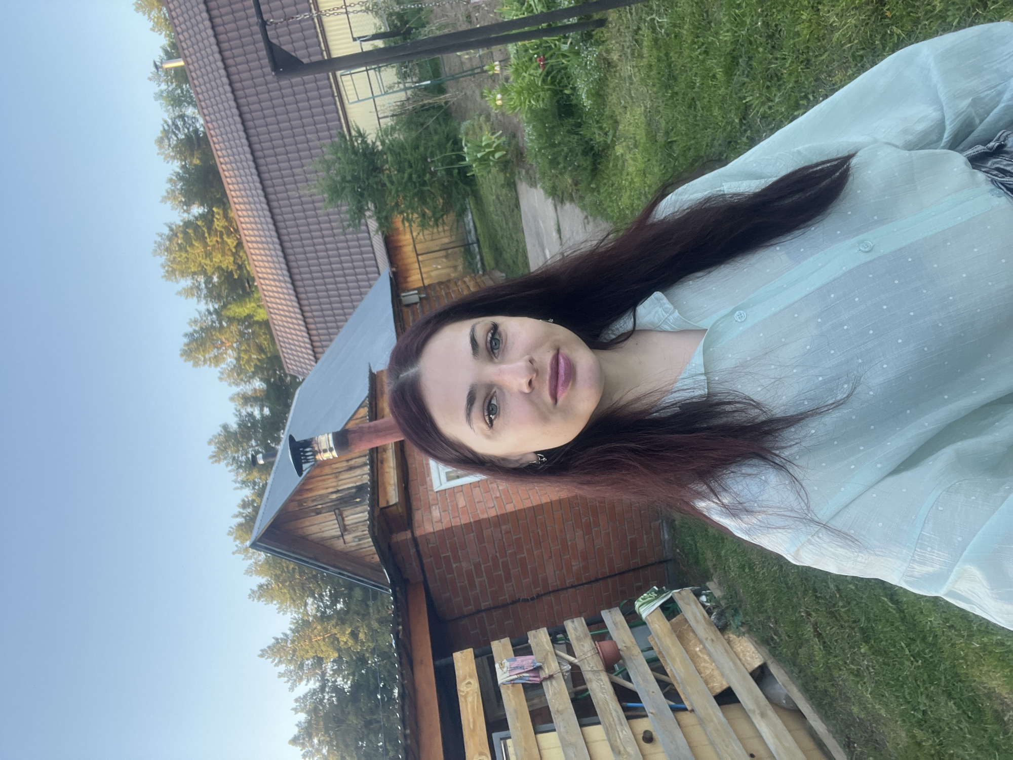 Woman documents spring garden and property in rural Russia