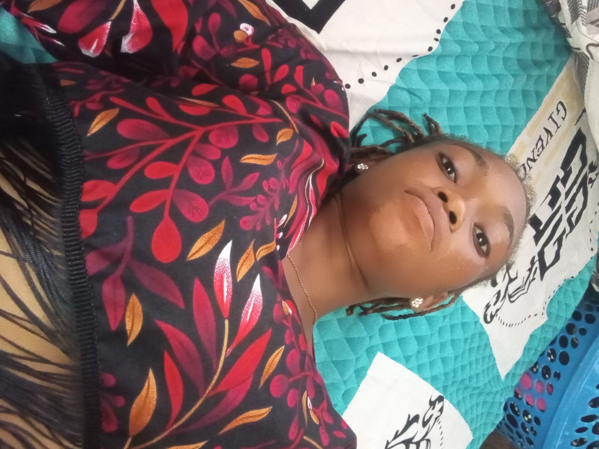 Woman takes multiple selfie portraits in Shagamu, Nigeria