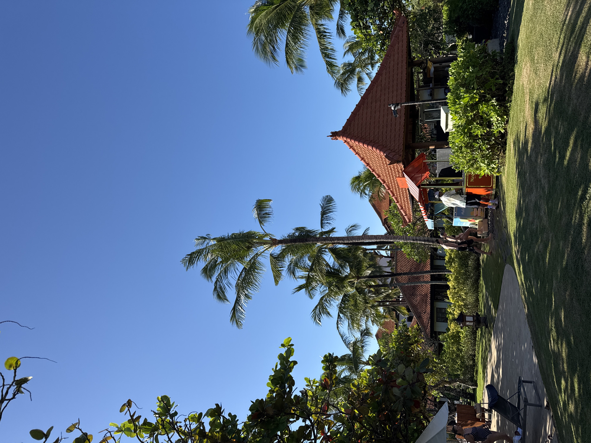 Morning beach preparations and family activity in Kuta Selatan