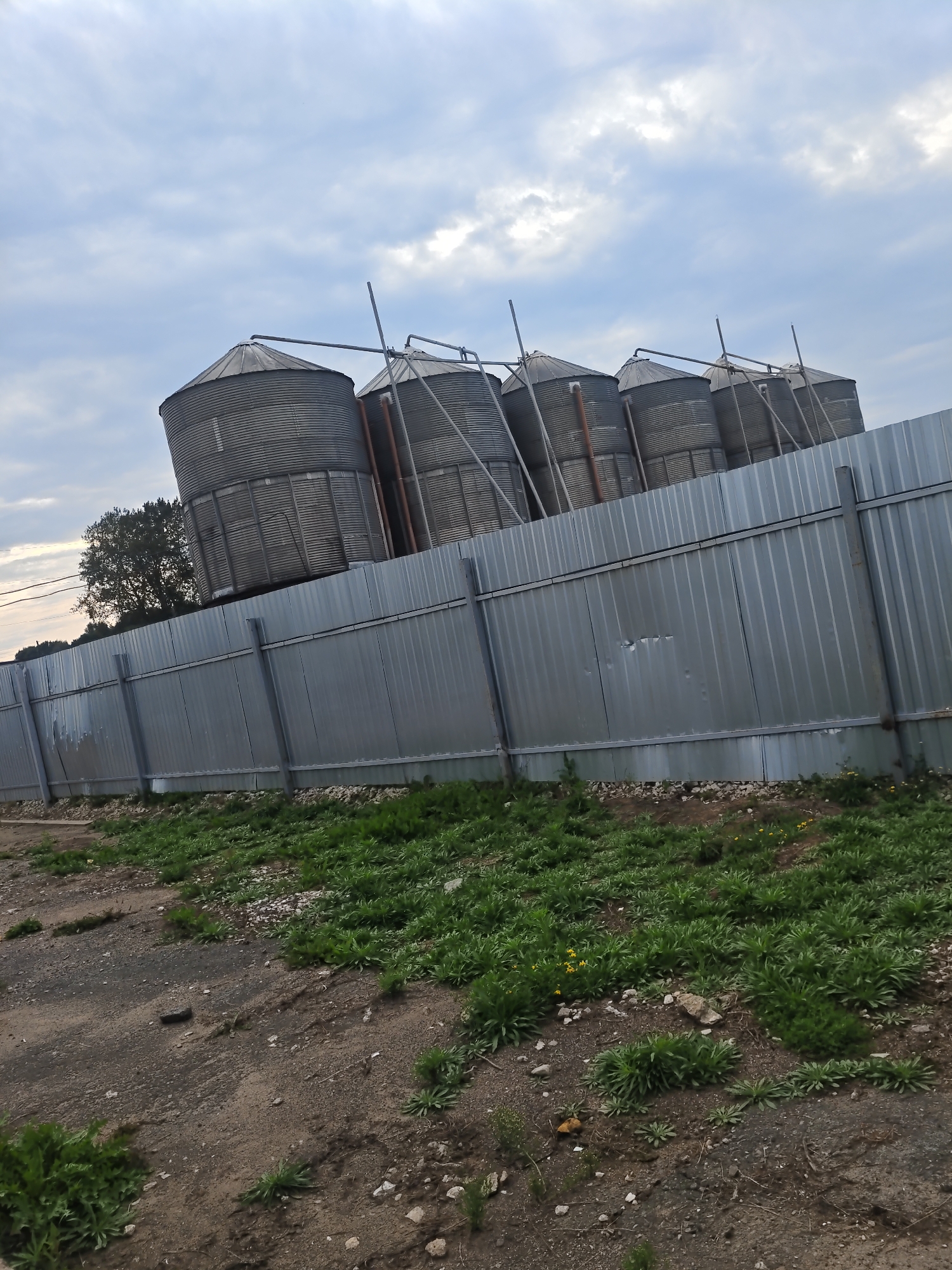 Weathered grain silo complex in rural Platoshino, Russia
