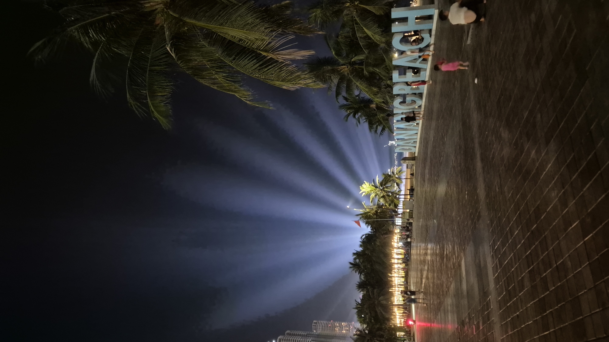 Da Nang's beachfront promenade alive on a rainy July night