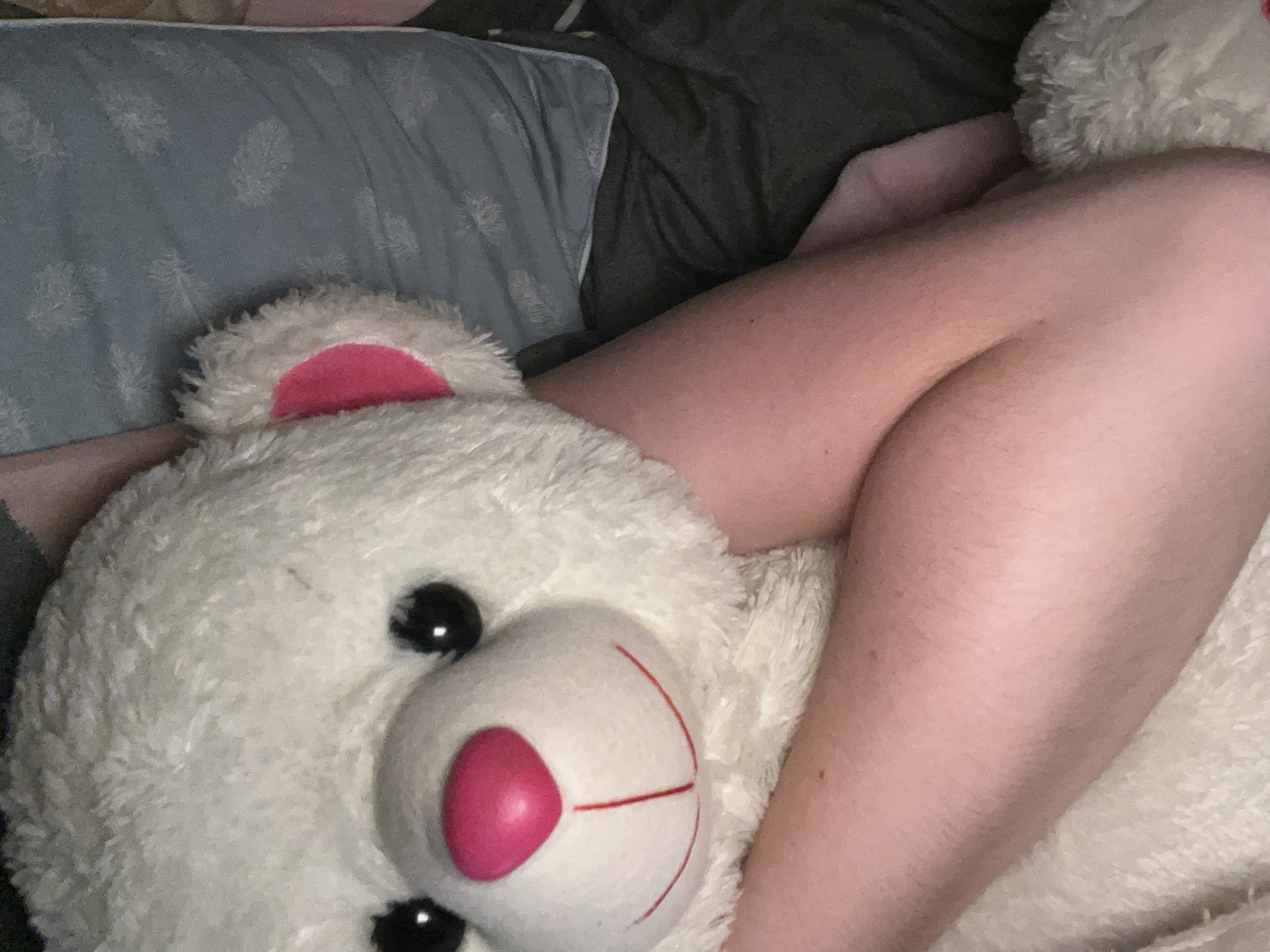Cozy room details: soft textures, a teddy bear, and ambient decor