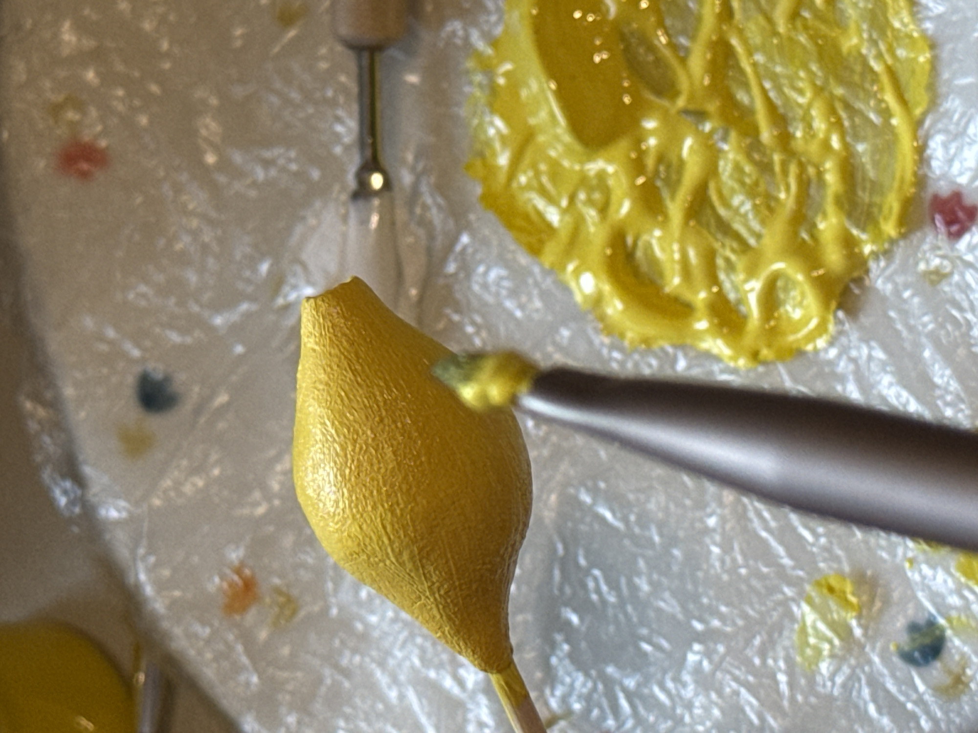 Handmaking lemon cake pops with paint and sculpting tools