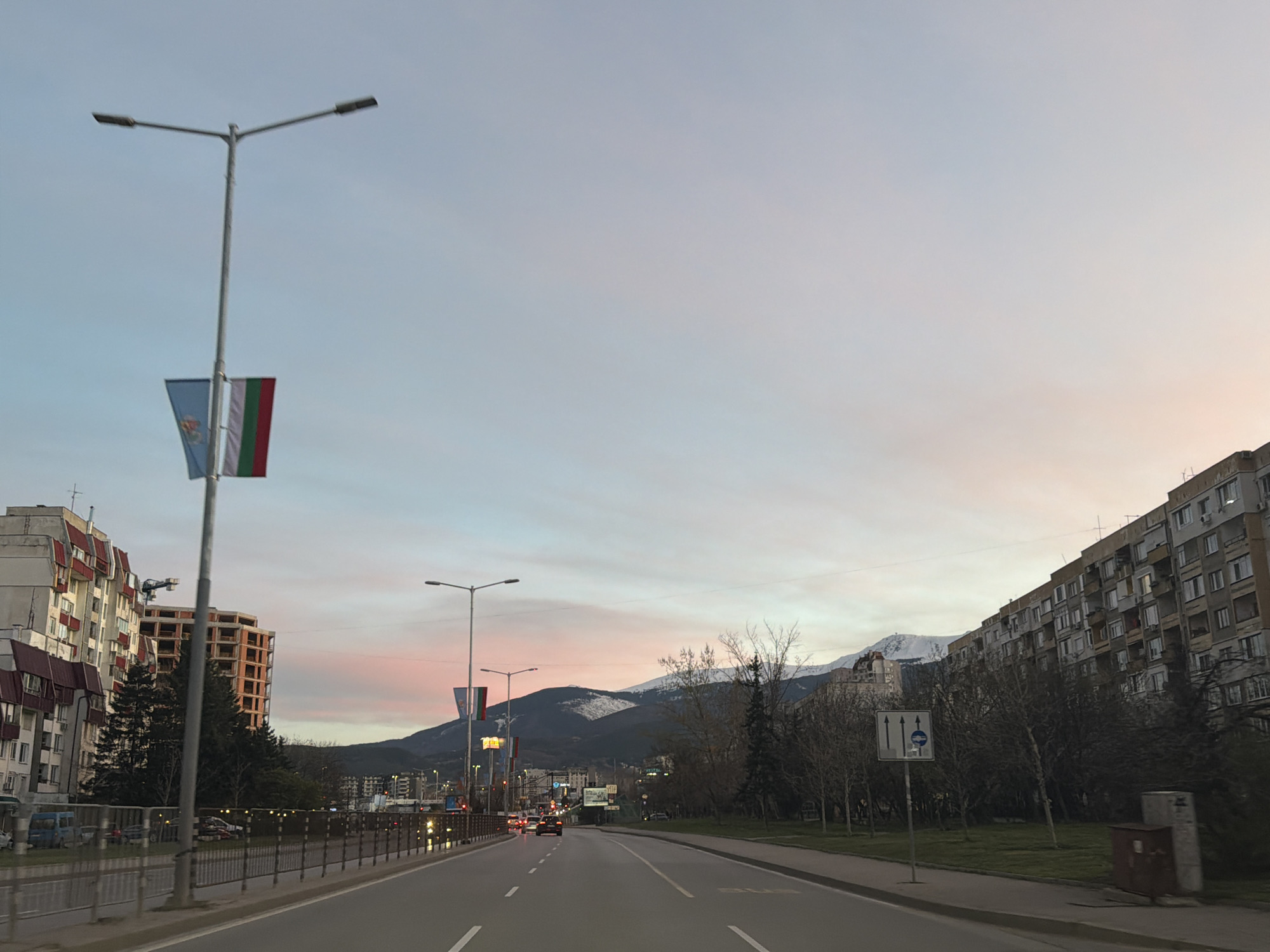 Evening traffic scene captured on Sofia street at dusk