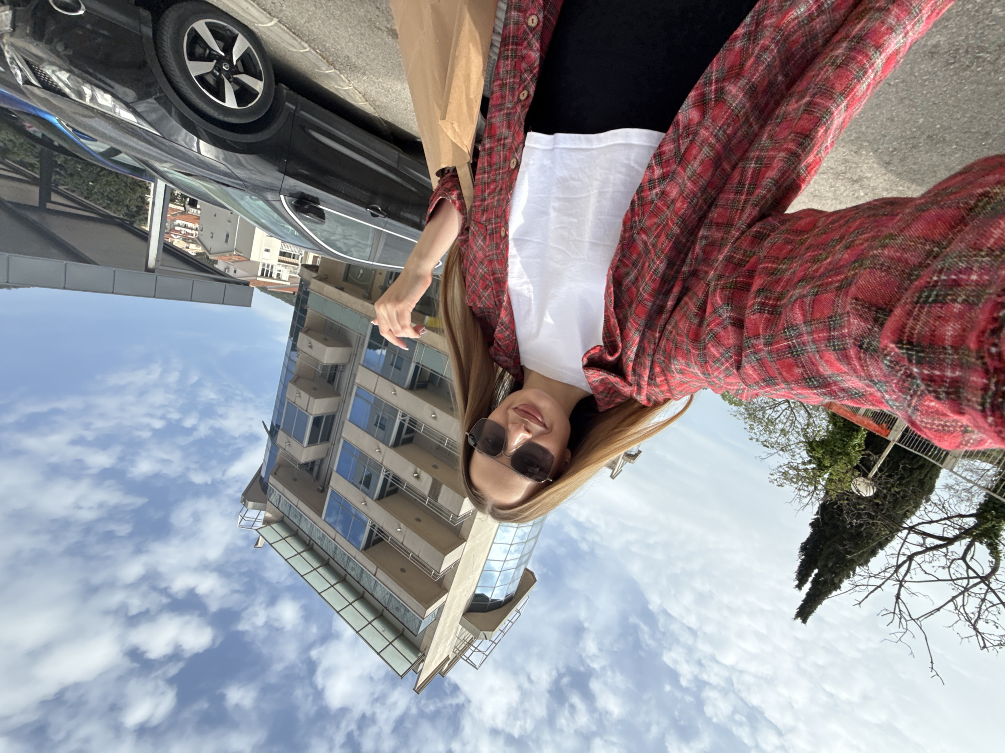 Woman with bag spotted on Budva sidewalk