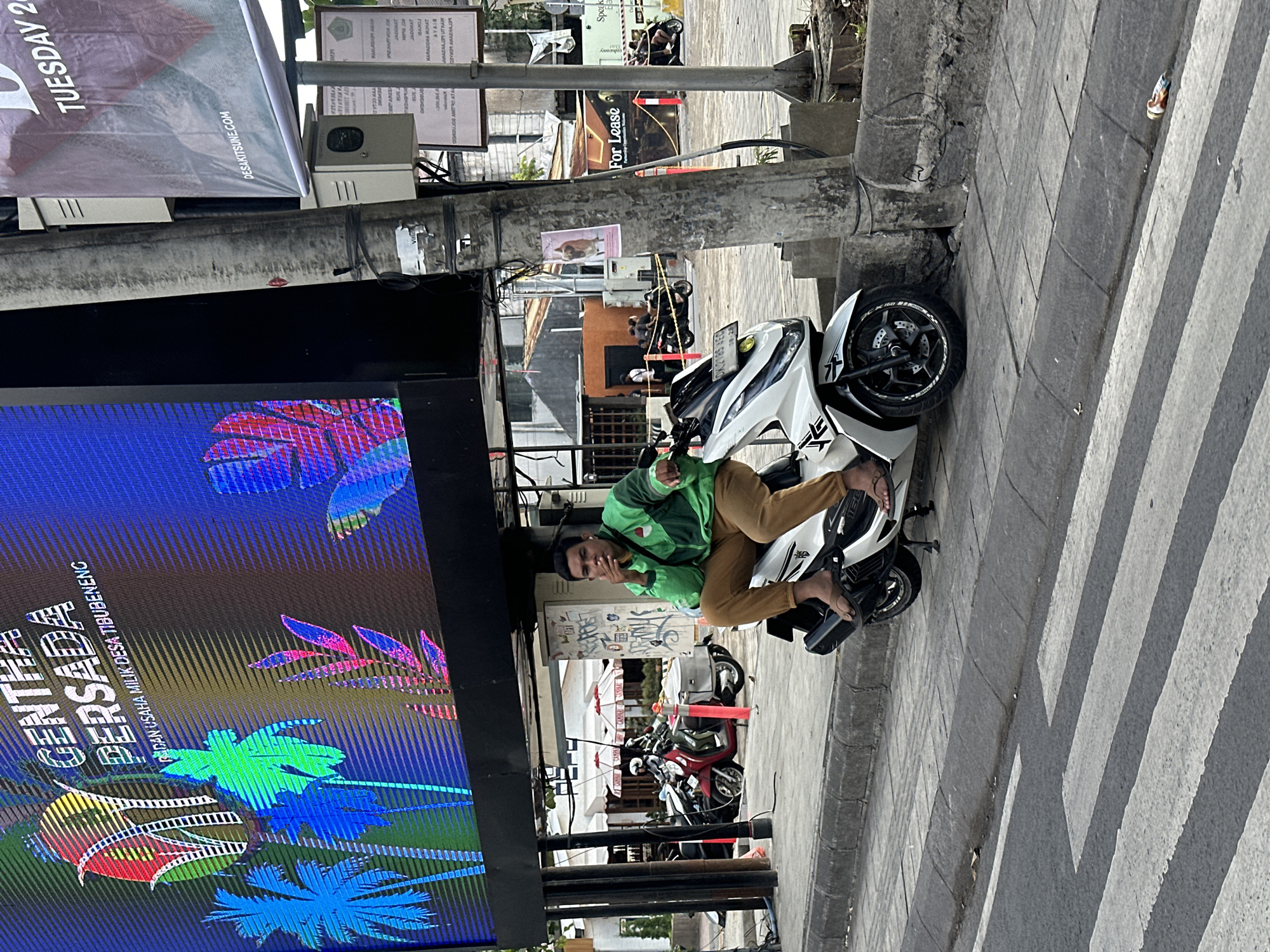 North Kuta streets busy with scooters, street food, and foot traffic