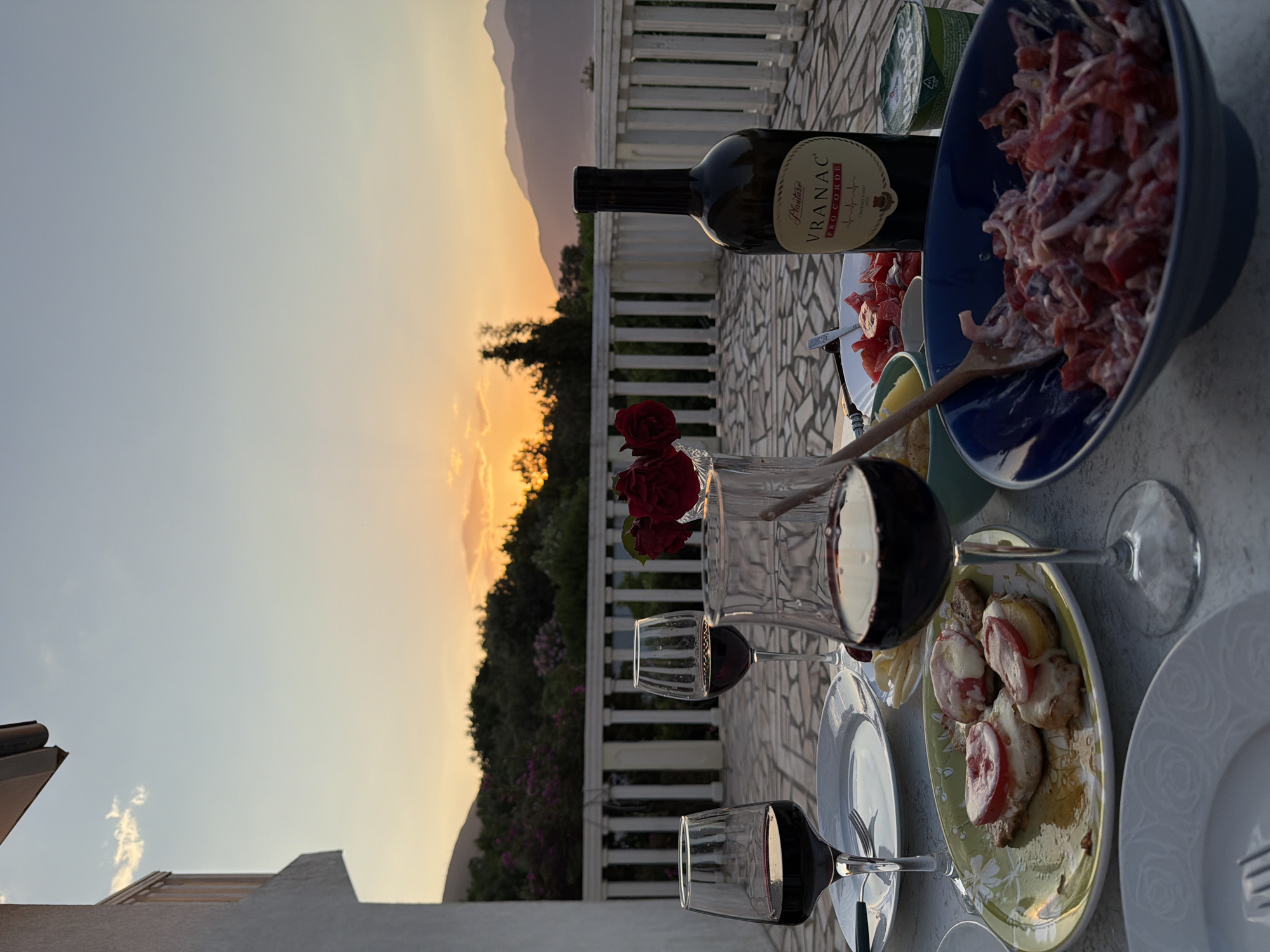 Sunset dinner documented in Gošići, Montenegro featuring local cuisine