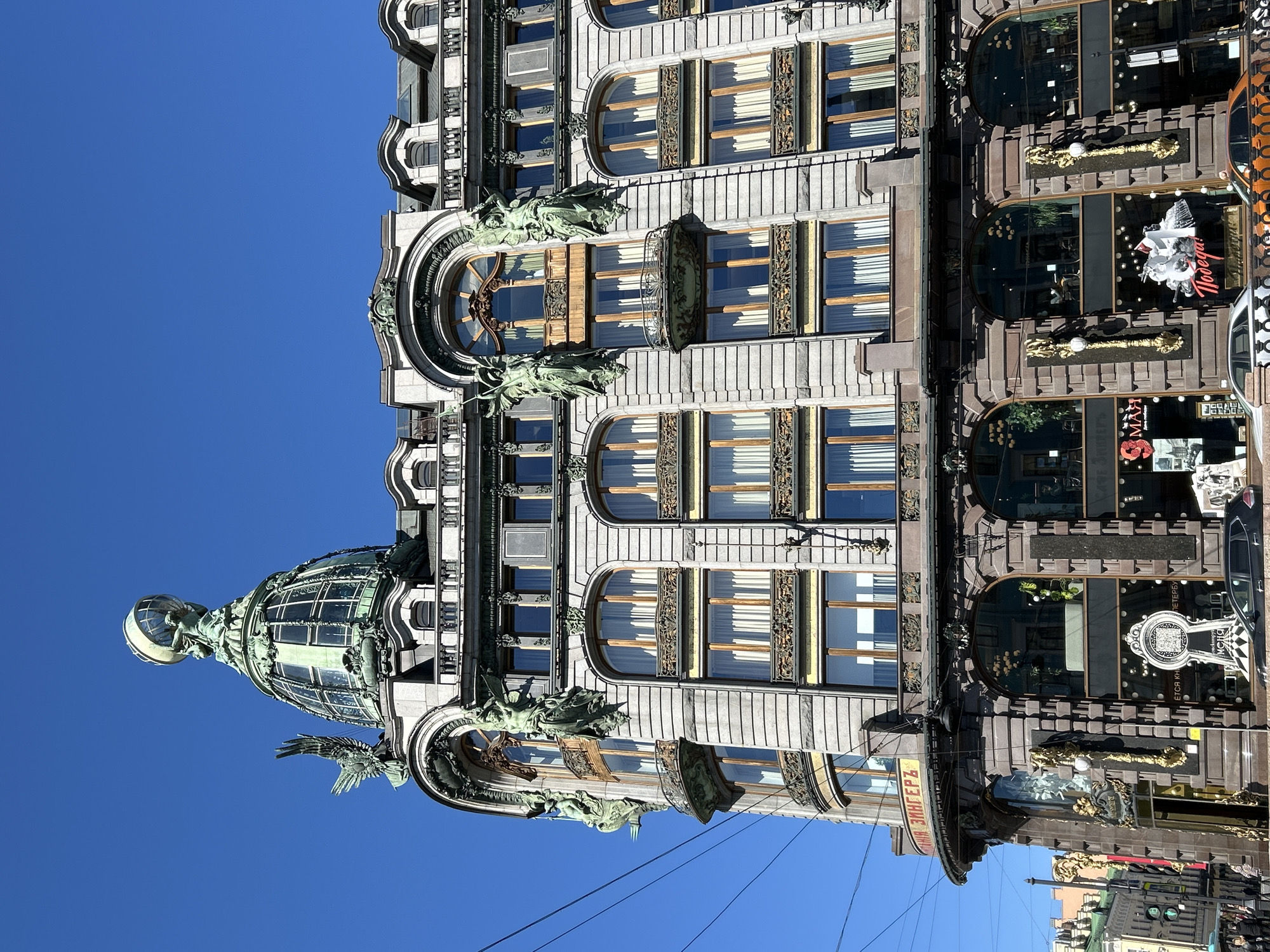 Industrial climbers maintain building facade near Singer House, St. Petersburg