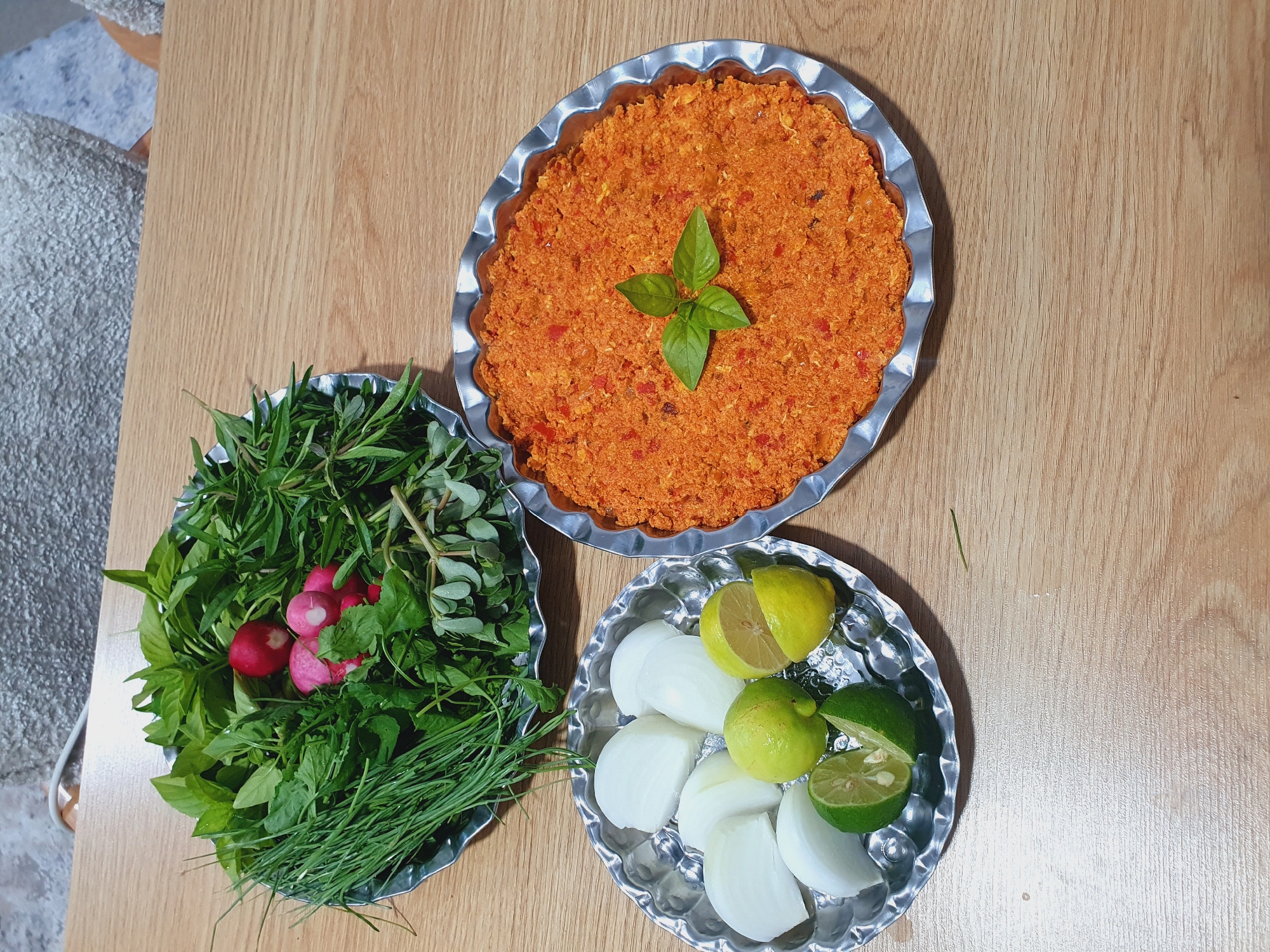 Evening meal preparation documented alongside rocky landscape in Kheyrabad