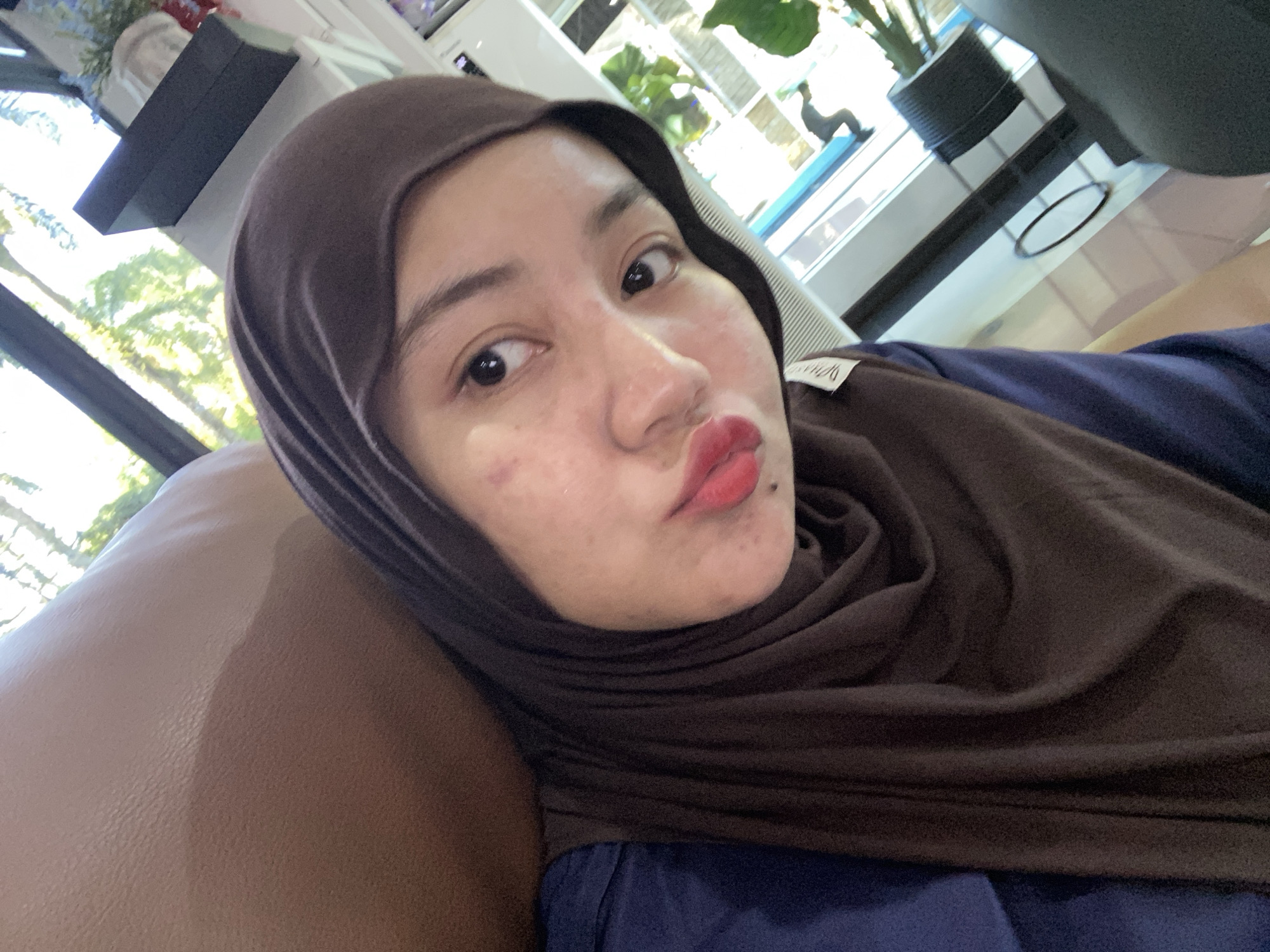 Selfies and waiting room scenes at a PLN office in Banjarbaru
