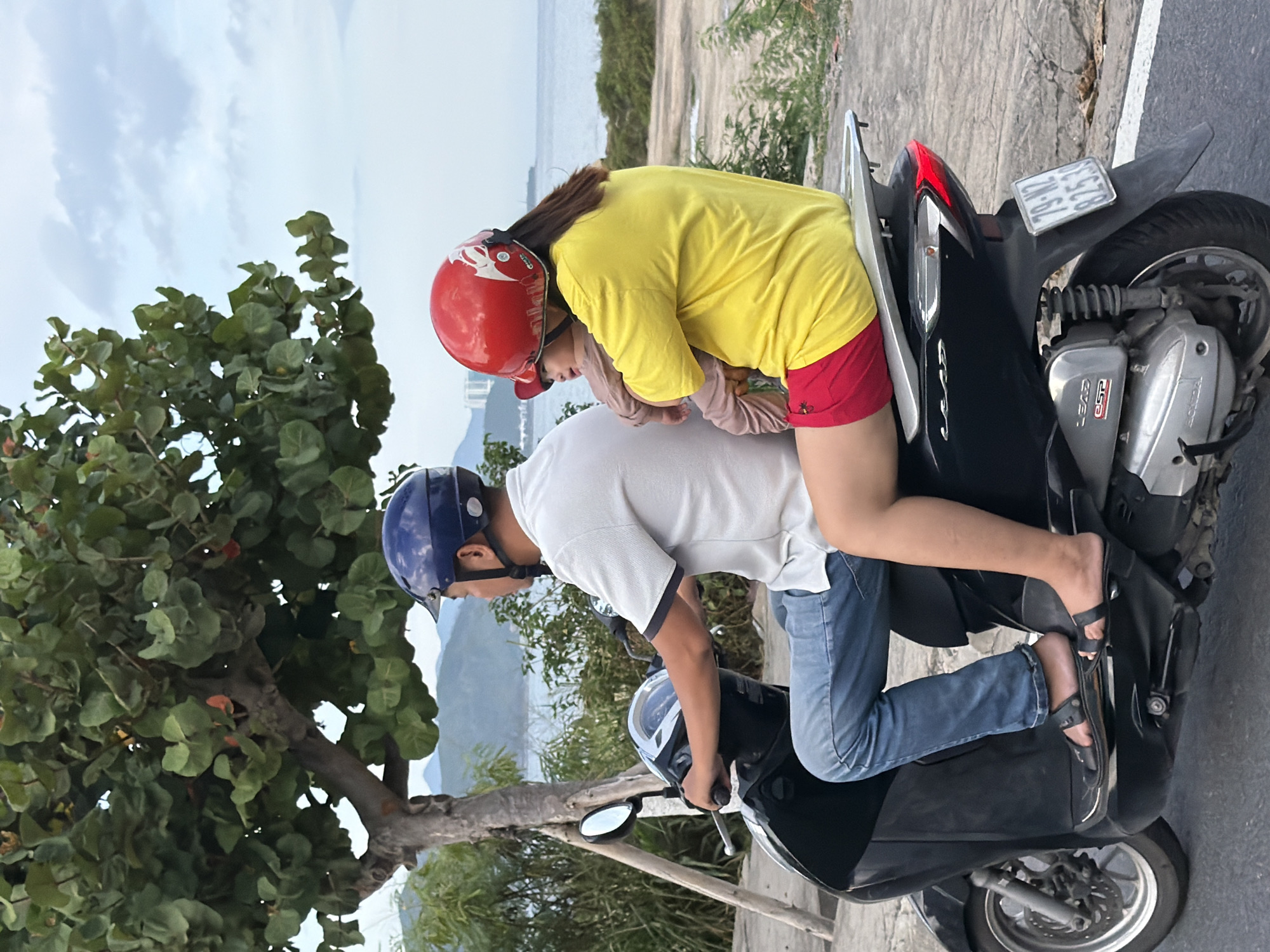 Scooters and street life along Nha Trang's coastal road