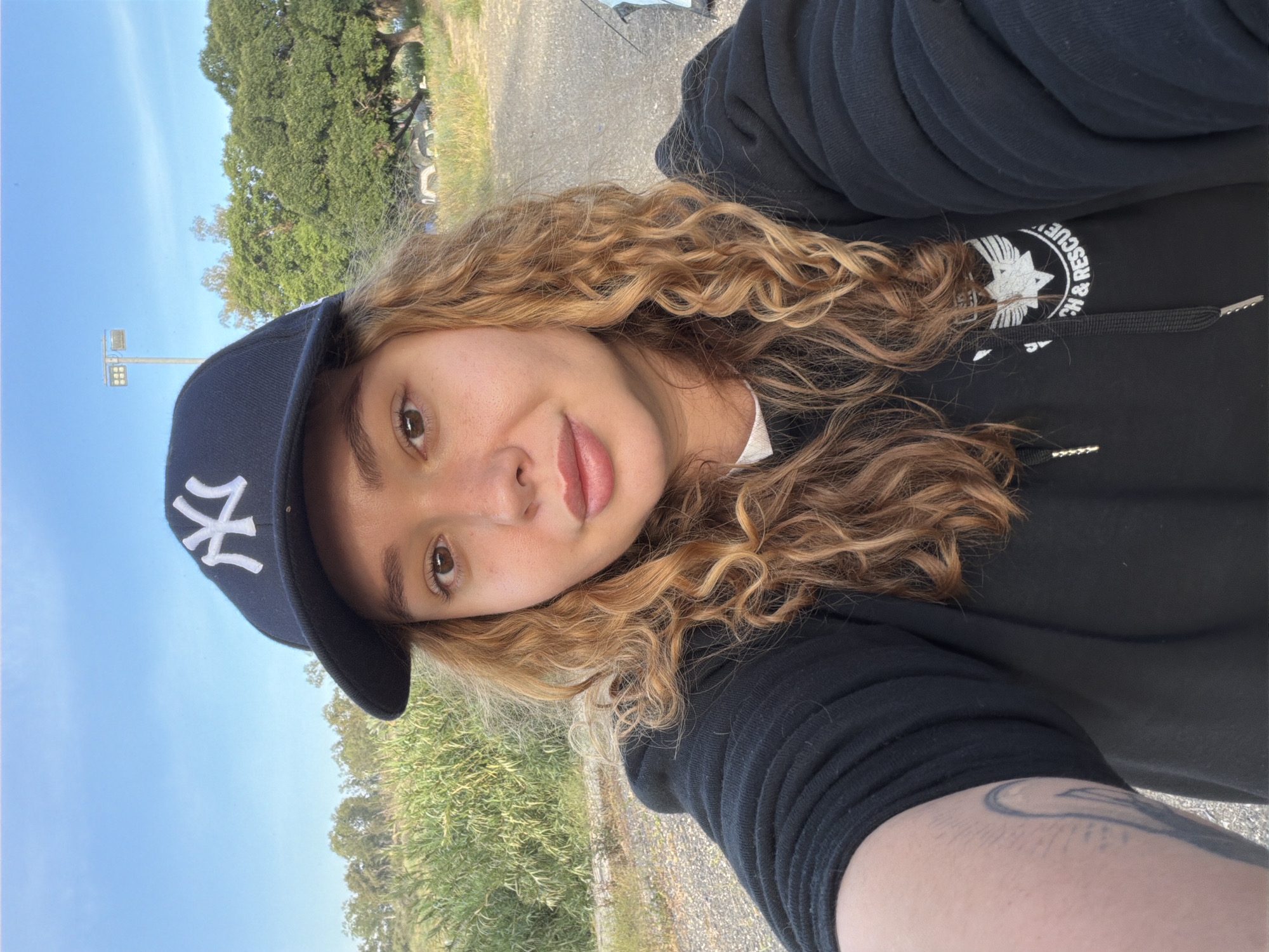 Woman takes selfie in Yankees cap in northern Israel