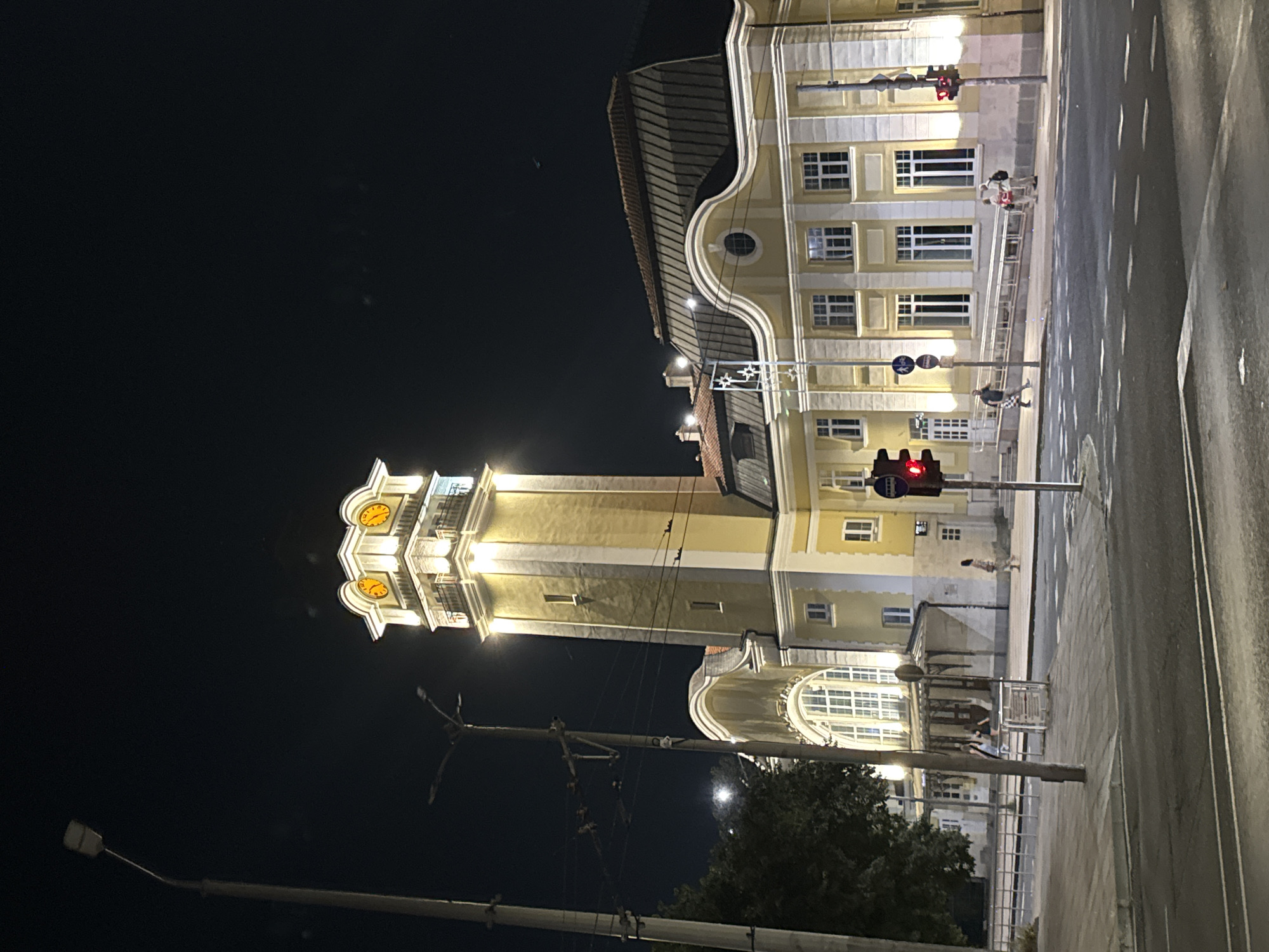 Burgas at dusk: clock tower, fountain square, and festive streets