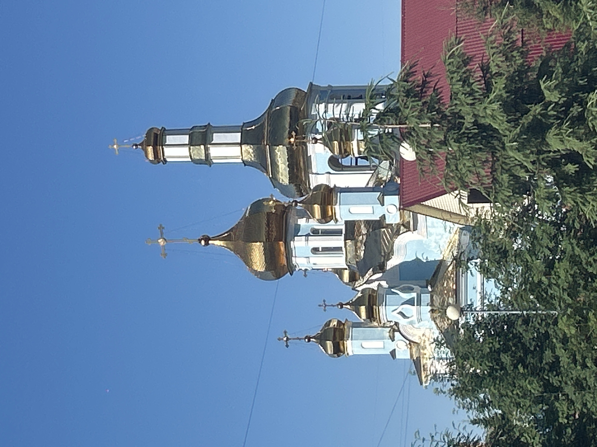 Churches, parks, and new construction across a Kemerovo summer day