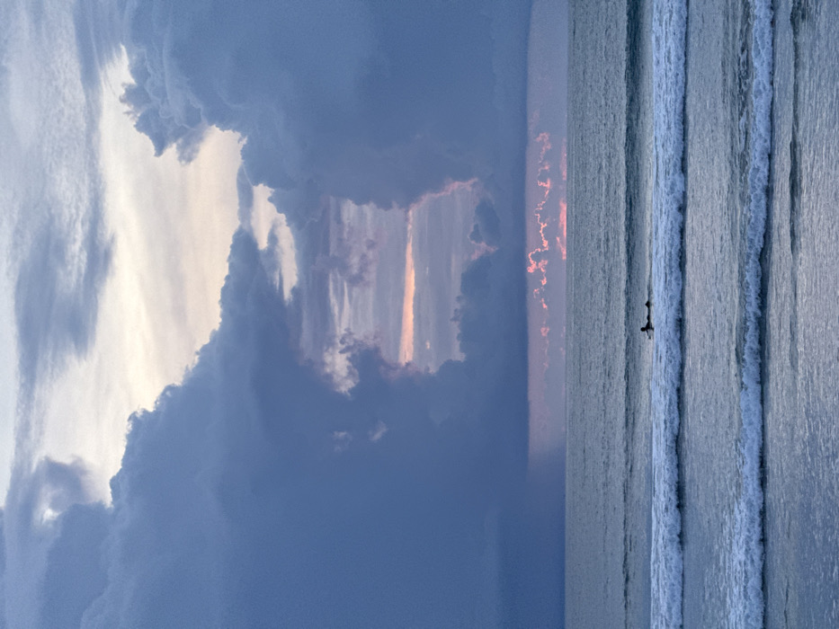 Storm clouds frame ocean view at Kuta beach