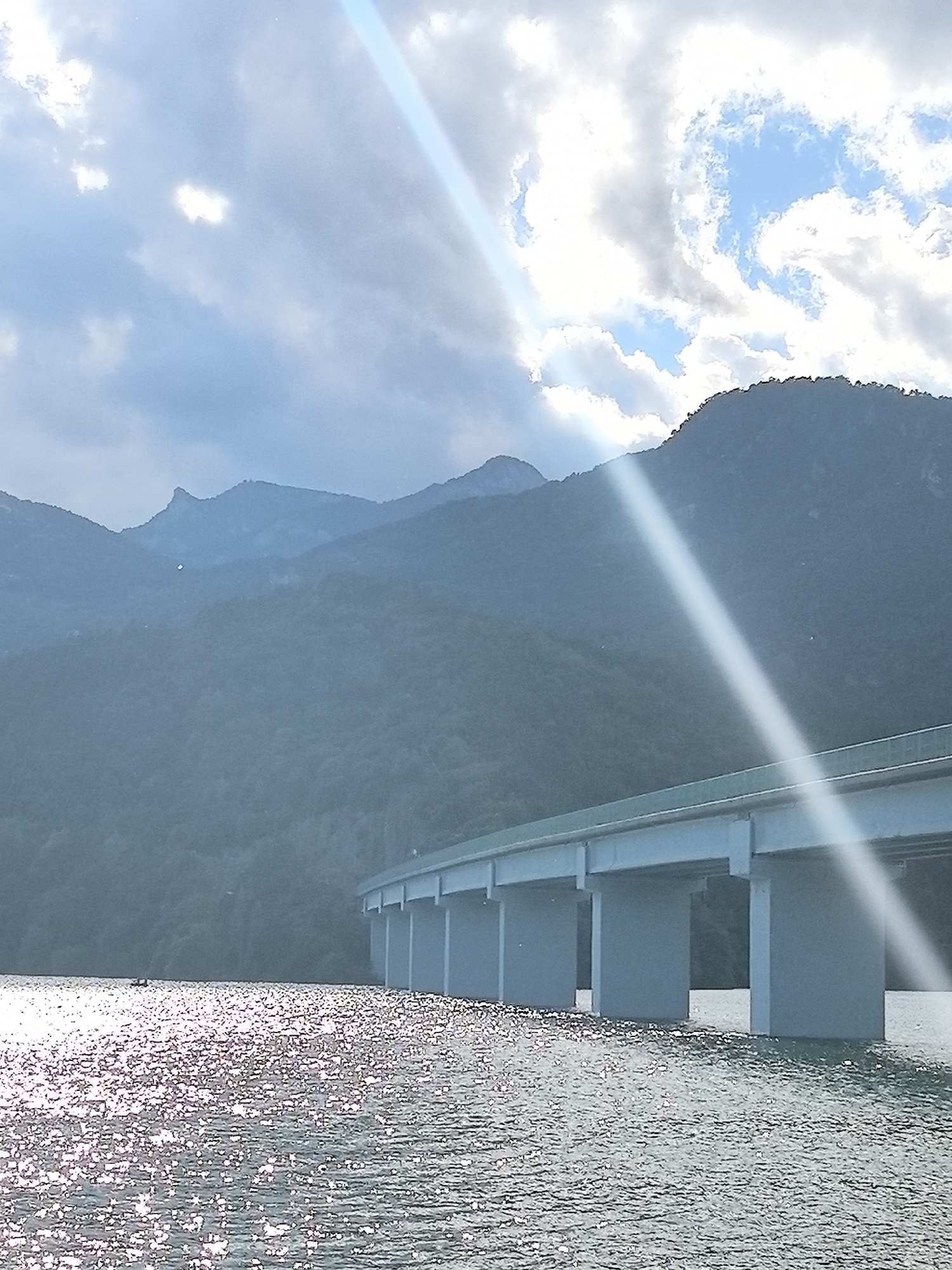 Sunlit bridge over Boadella reservoir captured in Cercs, Spain