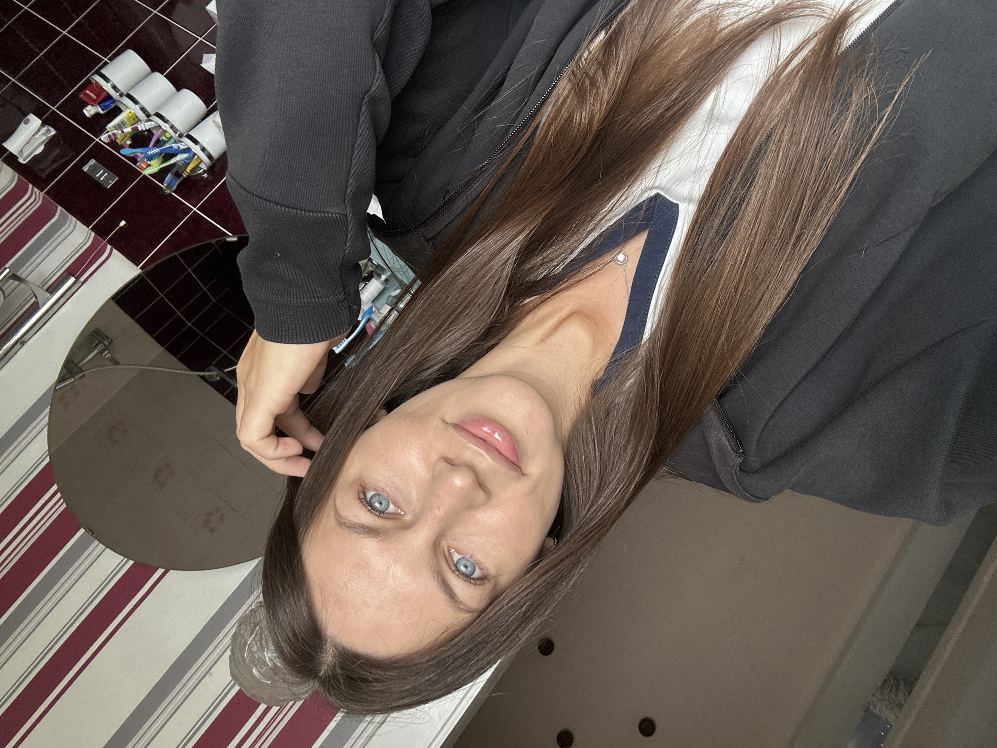 Woman Takes Multiple Selfies in Fredenbeck Germany Morning Session