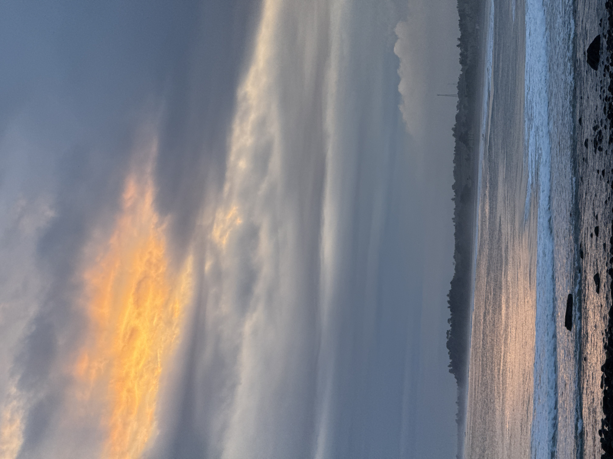 Two girls pose on beach during sunrise moment
