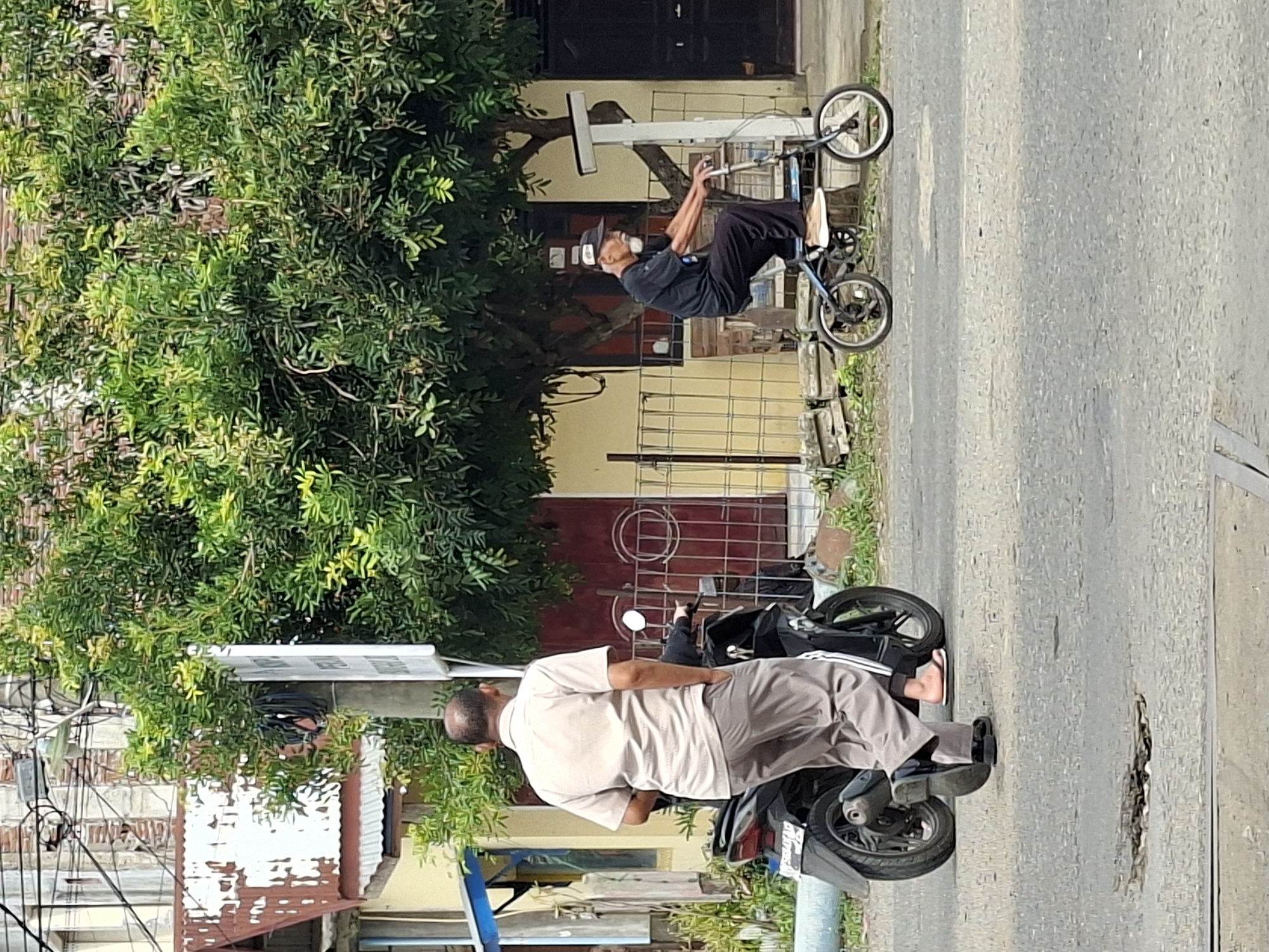 Everyday street traffic and activity in Lhokseumawe, Indonesia