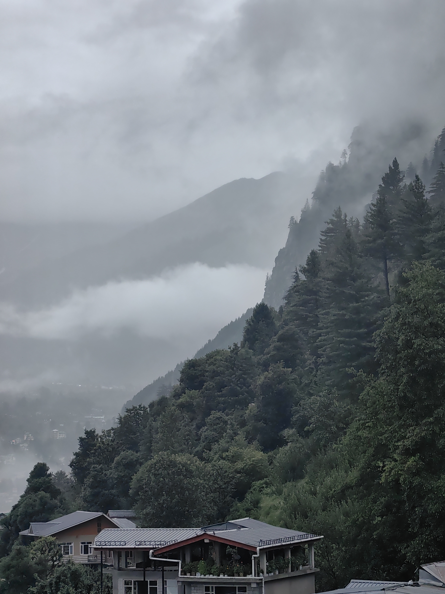 Vashisht soaked in monsoon fog, mountains barely visible