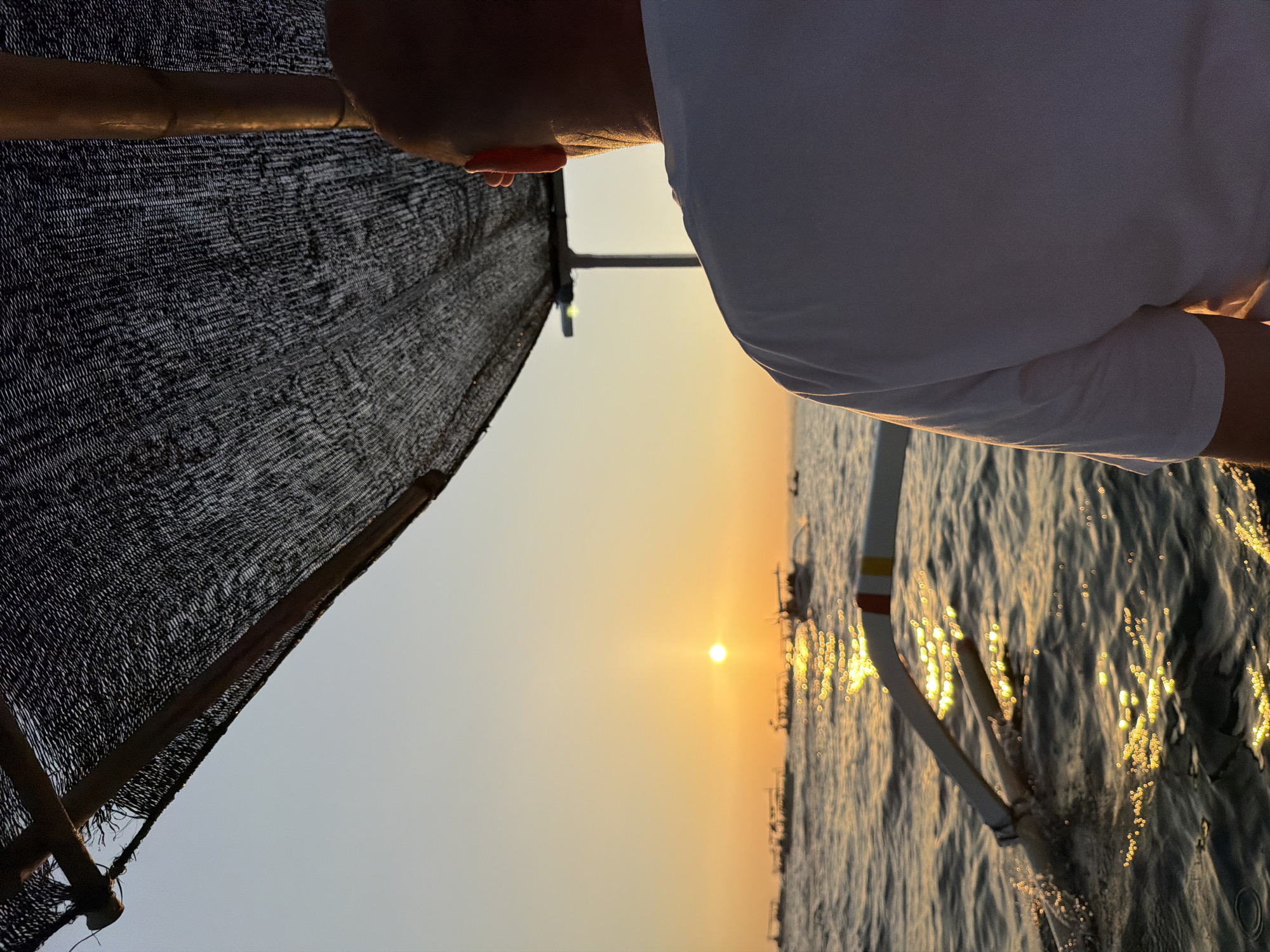Boats on the water at golden hour near Lovina Beach