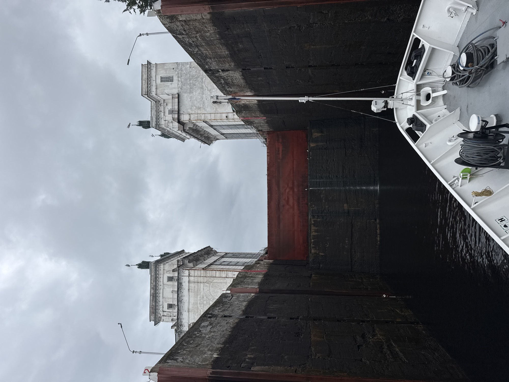 Anton Chekhov river vessel navigates a lock in Podporozhye