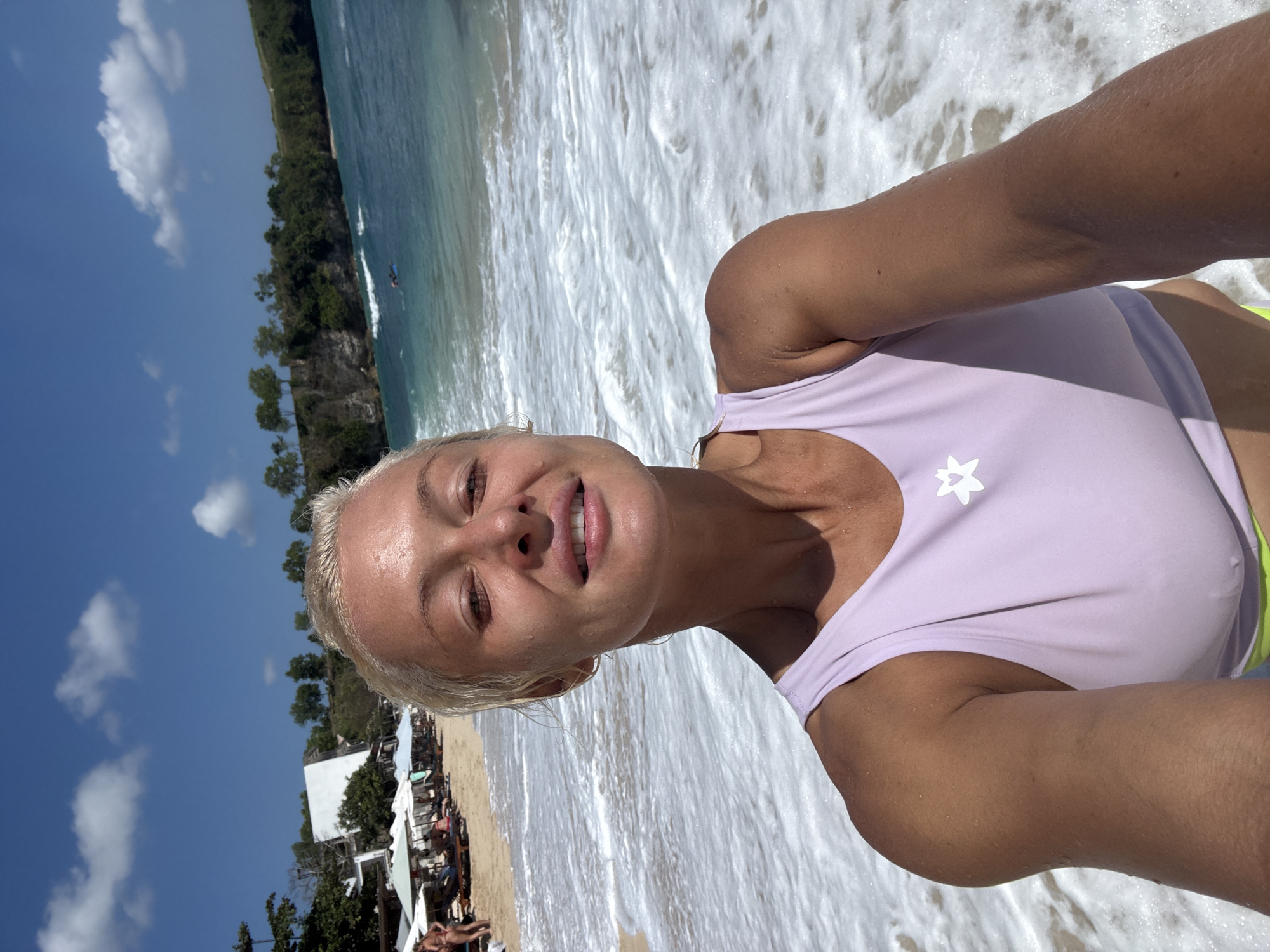 Beach selfies in the shallows, light purple star logo top