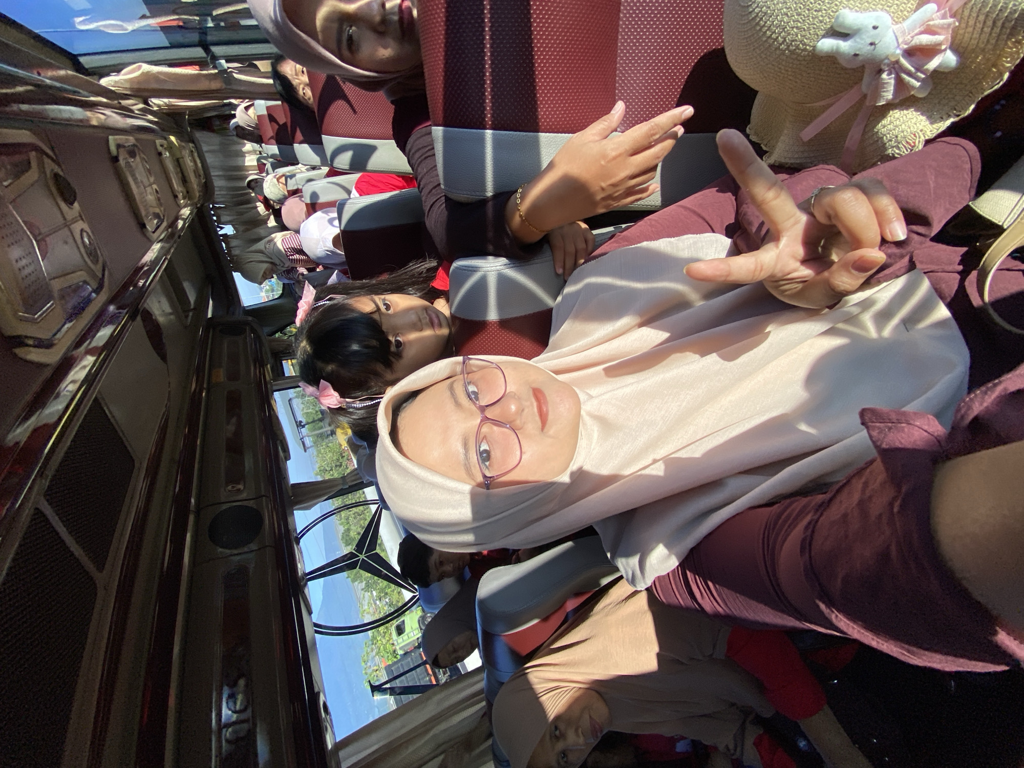 Woman photographed on passenger bus in Gempol, Indonesia