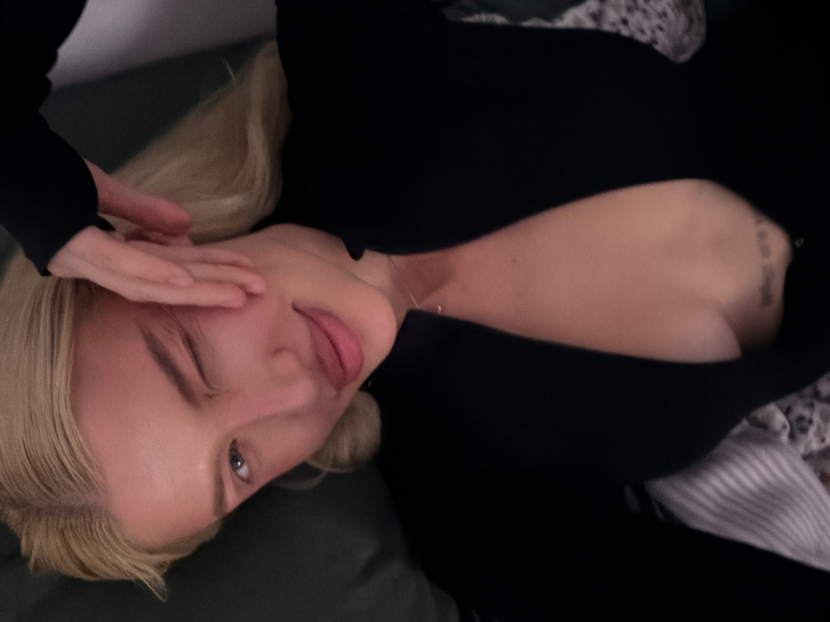 Blonde woman photographed indoors in Yurlovo, Russia
