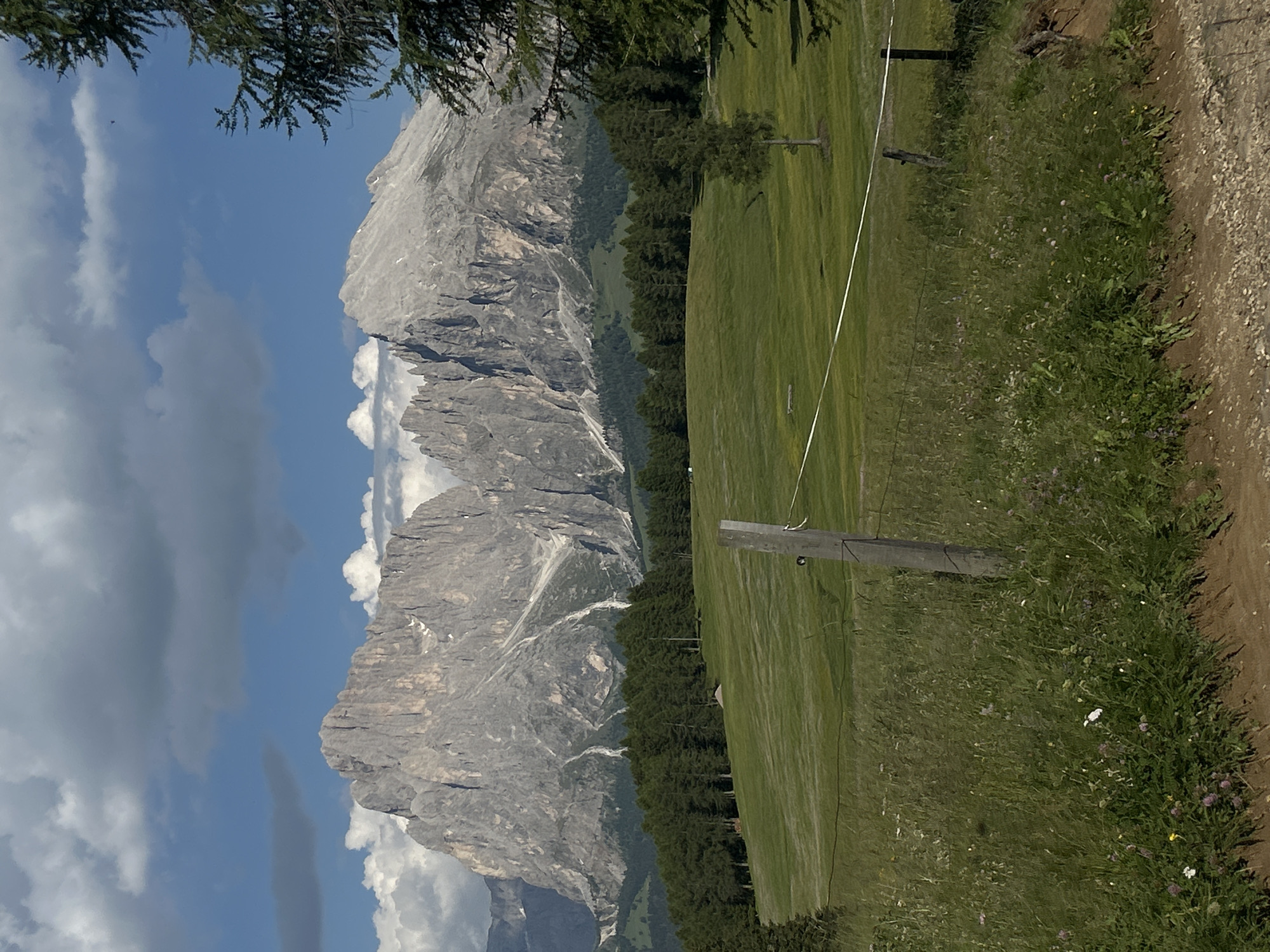 Afternoon hiking through alpine meadows and rustic mountain cabins