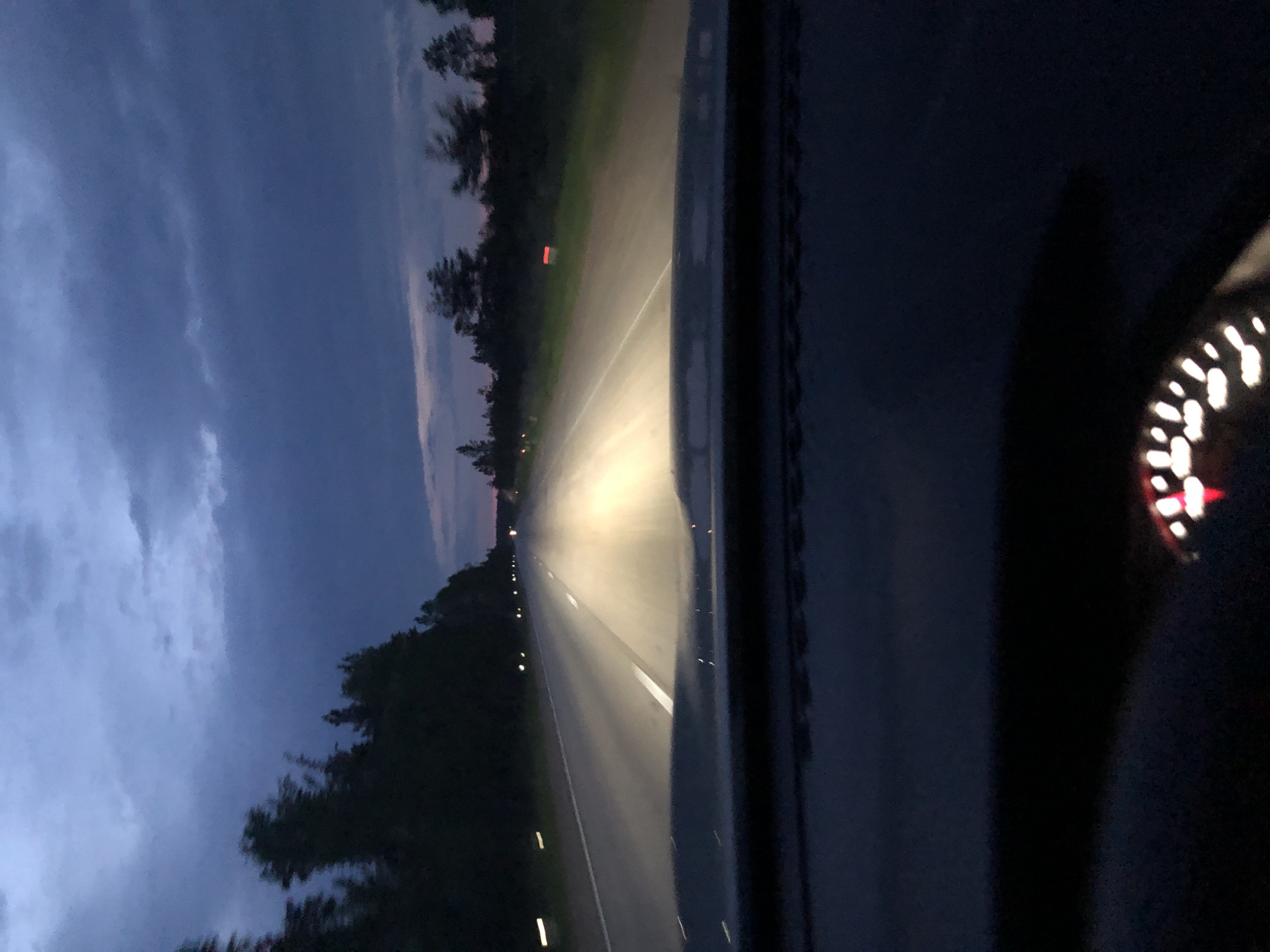 Vehicle travels highway near Kingisepp during twilight hours